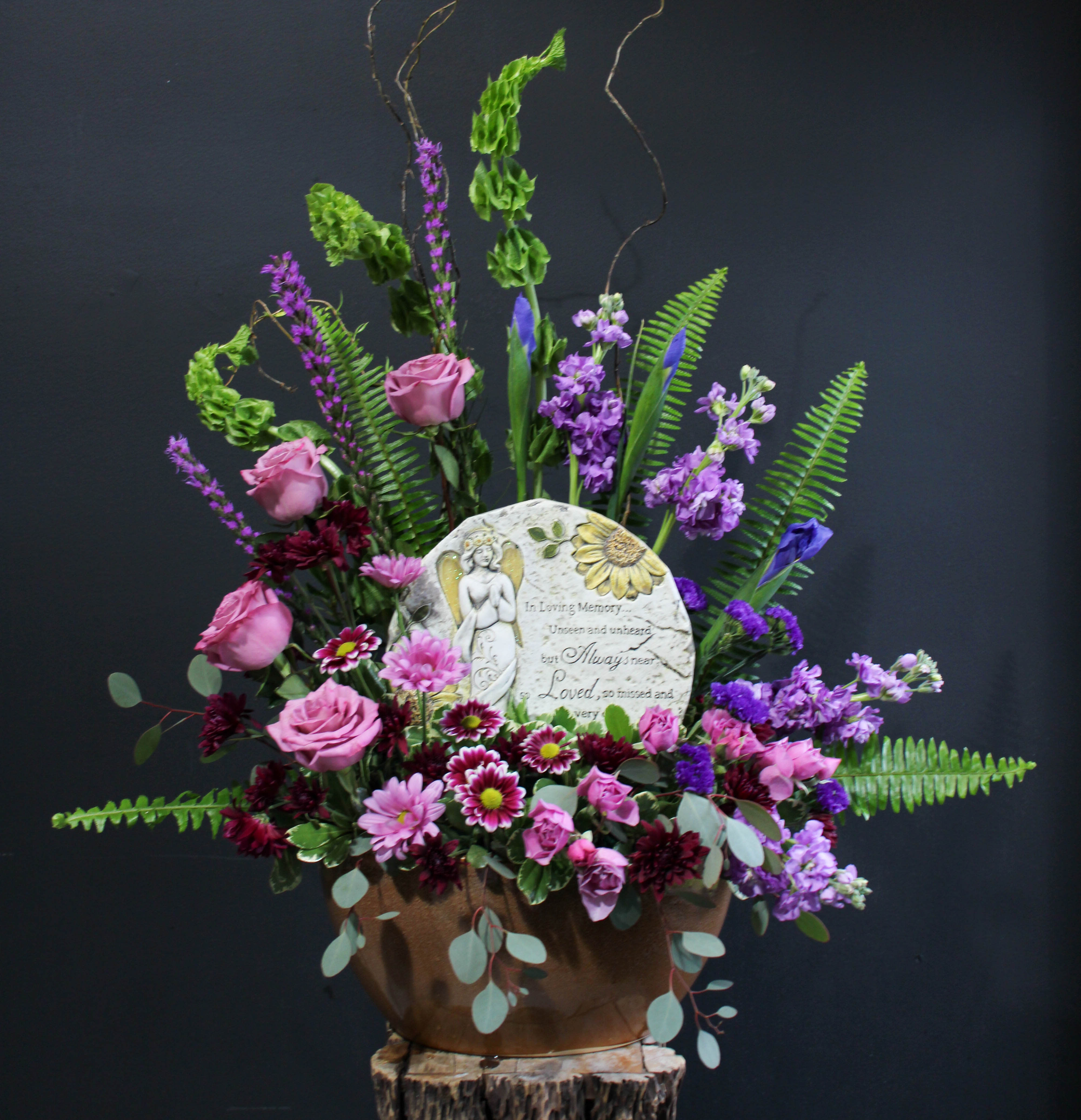 Loving Memories - &quot;In loving memory unseen and unheard but always near, loved, so missed and very cherished.&quot; A thoughtful arrangement with an abundance of greenery and purple flowers with a touching keepsake stepping stone.