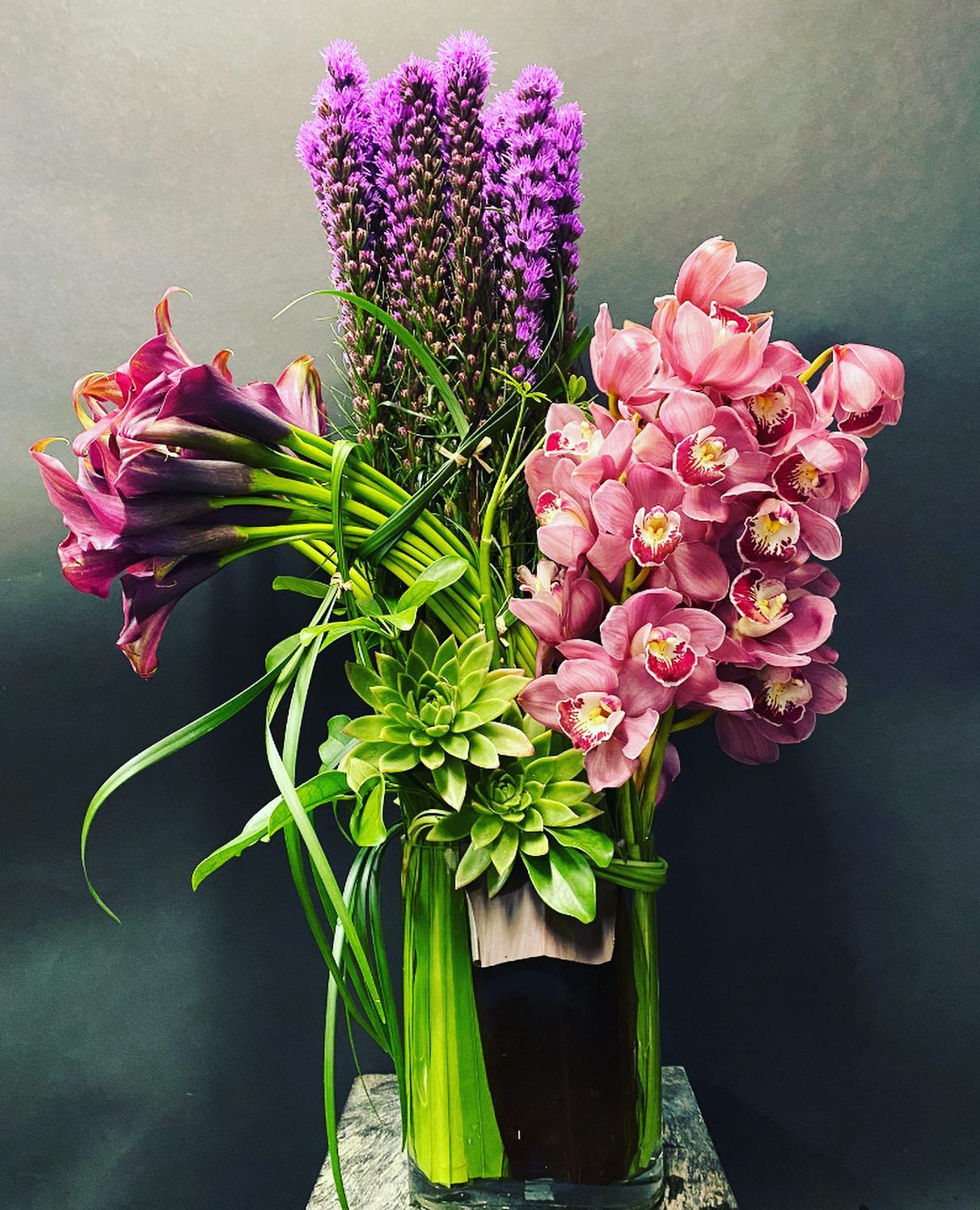FORD FORD - STRONG with Finesse Lisianthus... Calla Lillies...Cymbidium Orchid....Succulents.