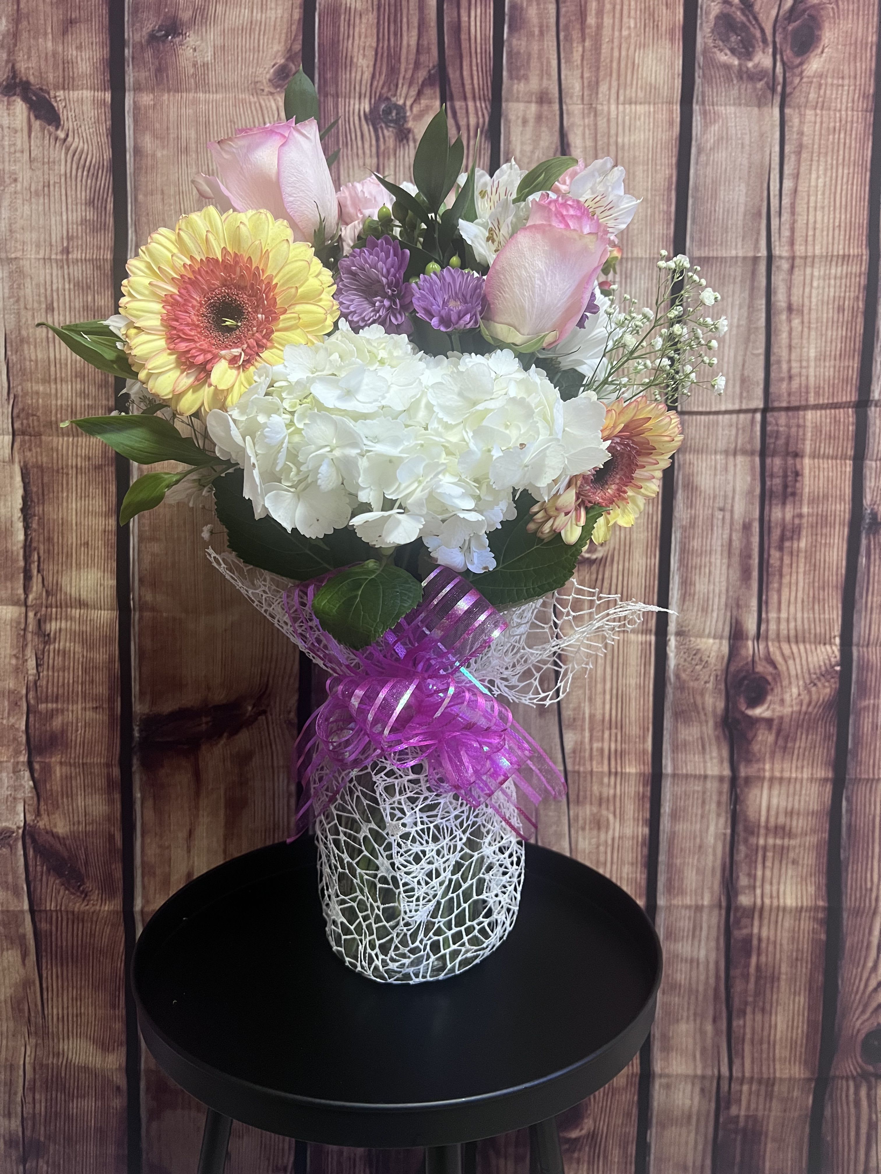 Designers Choice  - Seasonal flowers selected by the designer arranged in a vase. 