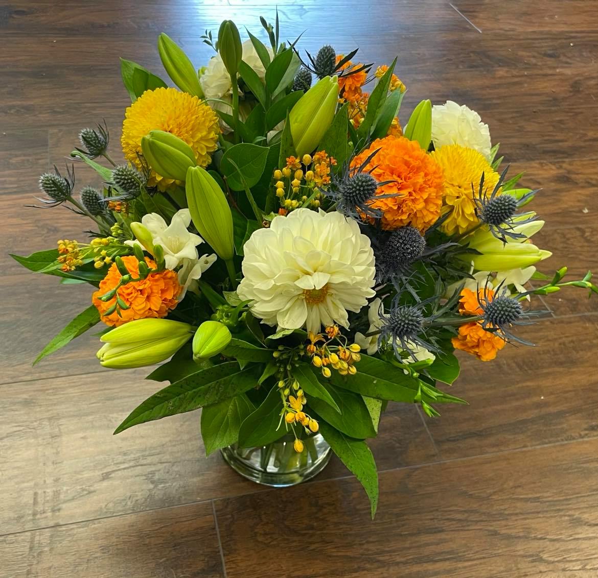 Deluxe Neutral Vase Arrangement Deluxe Neutral Vase Arrangement - Beautiful mix of fresh blooms arranged in a vase or container. All of our arrangements are 100% original, customizable and made-to-order.