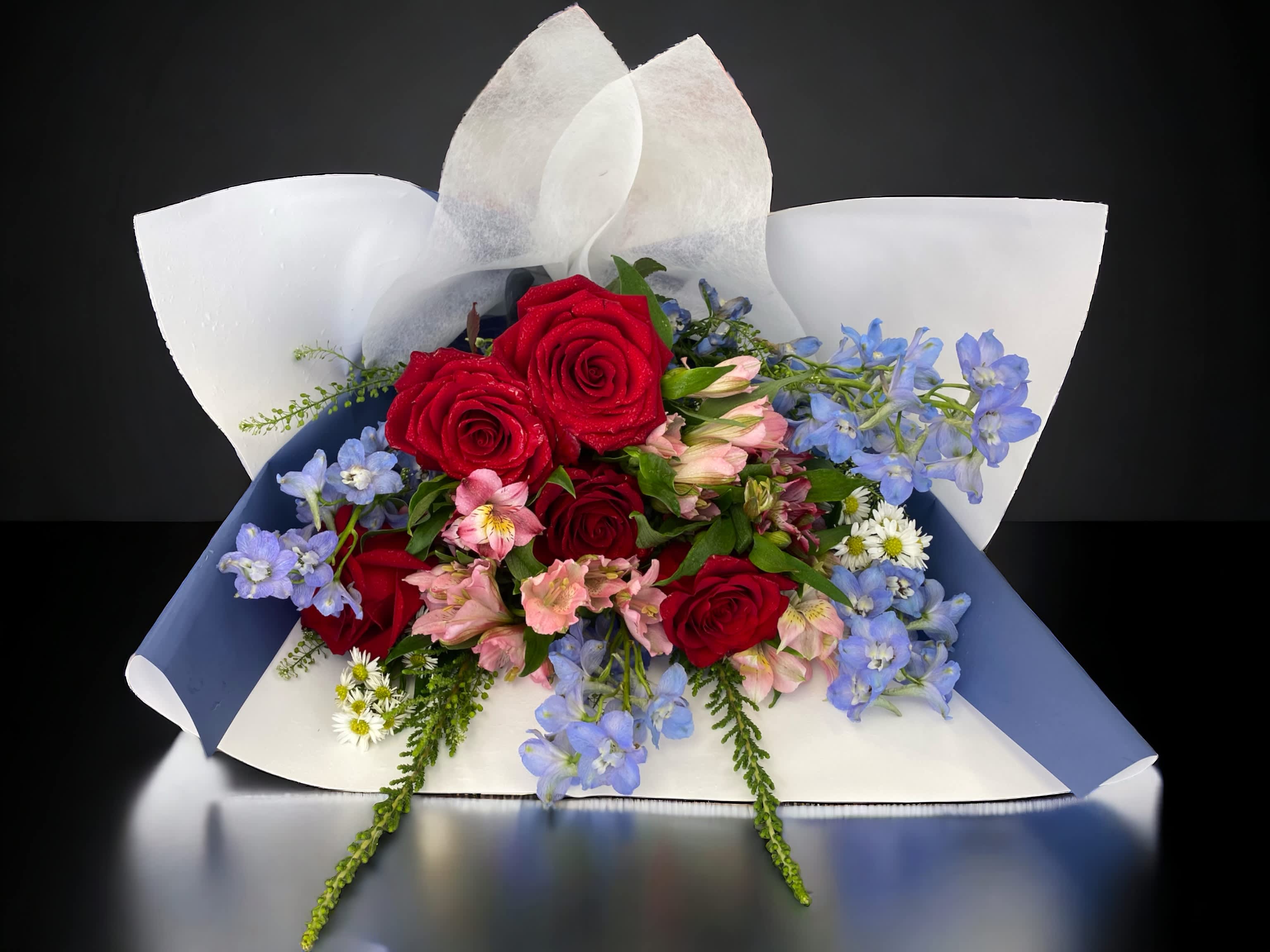 P&amp;P bouquet - A bouquet of 5 red roses, pink and blue flowers for any occasions. Deluxe is 10 roses. Premium is 15 roses.  We offer different colors and styles for wrapping paper. Please note in Florist Instructions your choice of wrapping paper. We have one solid color like red, pink, white, classic brown, clear, etc. We also have two side colors like white/gold, light pink/hot pink, pink/purple, blue/white etc. And lastly, we have them in shiny/iridescent colors, or texture/style paper. Call us at 323-961-6686 if you have any questions.
