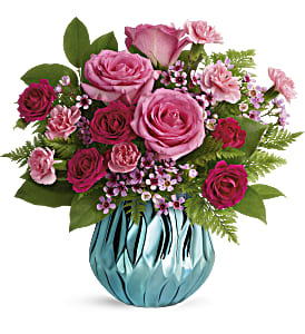  Gem Of My Heart Bouquet - Make mom feel like the gem that she is with this magnificent mirrored ceramic vase, fabulously faceted to catch in the light! Bursting with lush pink roses, it's a sparkling reminder of your love. Pink roses, dark pink spray roses, pink miniature carnations, and lavender waxflower are arranged with leatherleaf fern and lemon leaf. Delivered in a Gem of My Heart vase. Approximately 12 1/2&quot; W x 11 3/4&quot; H
