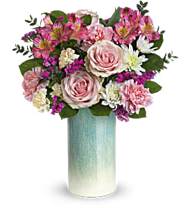 Sweet Aqua Bouquet - Nothing's prettier than soft pinks and sparkling aqua! Treat their senses with Teleflora's Sweet Aqua Bouquet featuring fresh pink blooms arranged in an artisanal stoneware vase washed with a shimmering aqua glaze. Light pink roses, white cushion spray chrysanthemums, pink alstroemeria, miniature light yellow carnations, raspberry sinuata statice and pink carnations are arranged with parvifolia eucalyptus and lemon leaf. This fresh flower arrangement is delivered in Teleflora's Aqua Allure vase. Approximately 14&quot; W x 16 1/4&quot; H