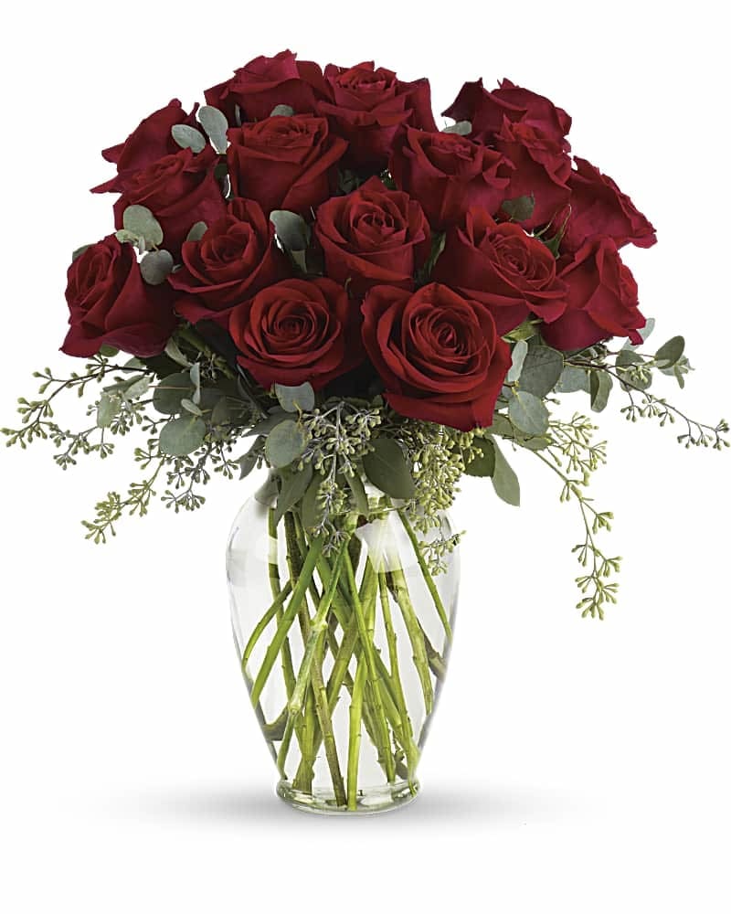 Forever Beloved - Forever beloved. Forever in your heart. Forever close to you. That is what this beautiful rose arrangement symbolizes. A shared life. Or a shared sacred moment. All will be dignified beautifully with this loving gift of roses in a classic urn. 18 red roses are arranged with beautiful eucalyptus and a lovely ming vase. Say it with flowers, when no words will speak the feelings in your heart.