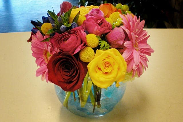 Bubble Vase Mix Bouquet - A mix of roses, daisies, and other seasonal floral in a glass bubble vase