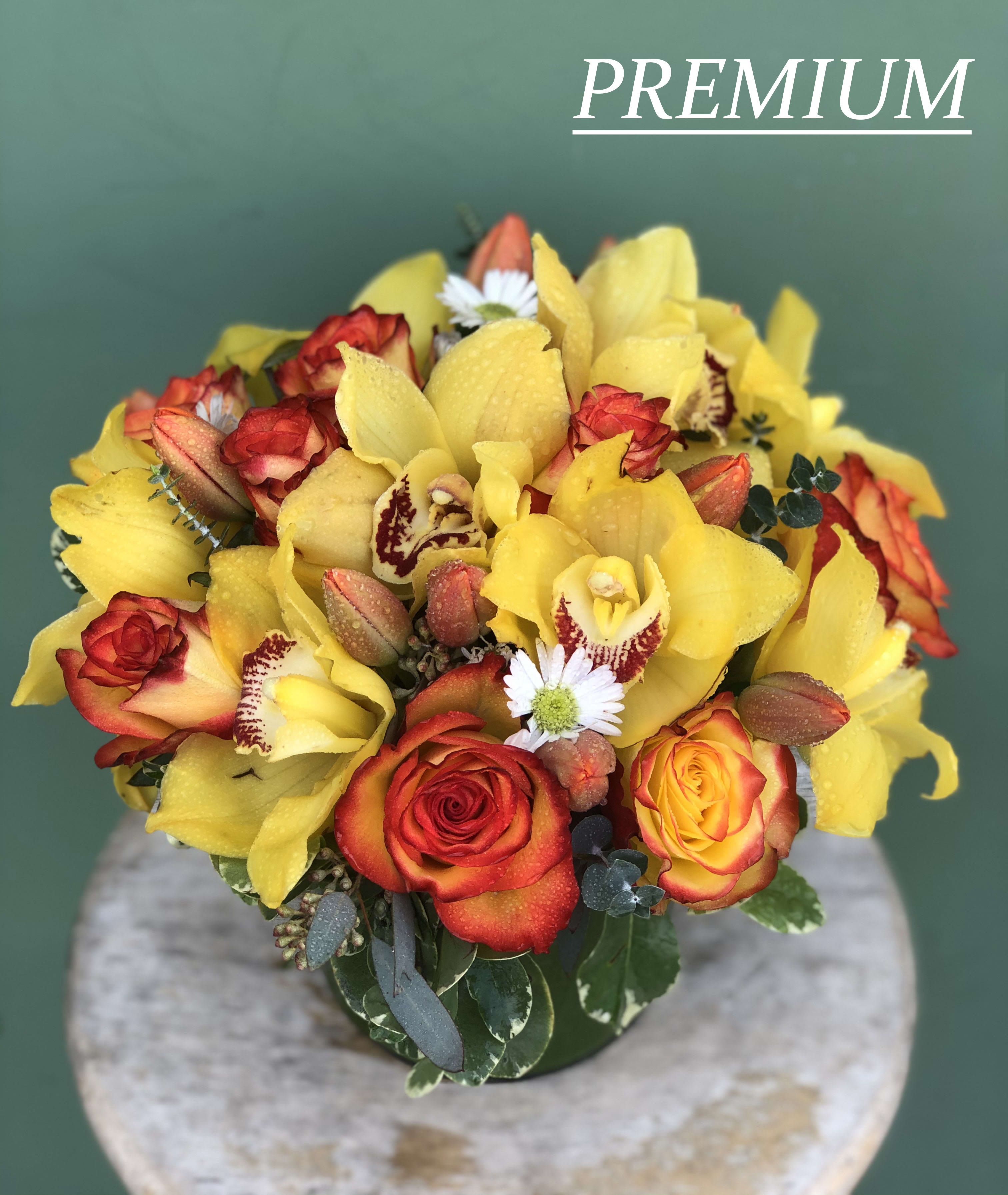 Roses Tulips and Everything Nice - Cute and unique vase complemented with Roses, Tulips, Orchids, and Greens.  Note: The picture shown is premium