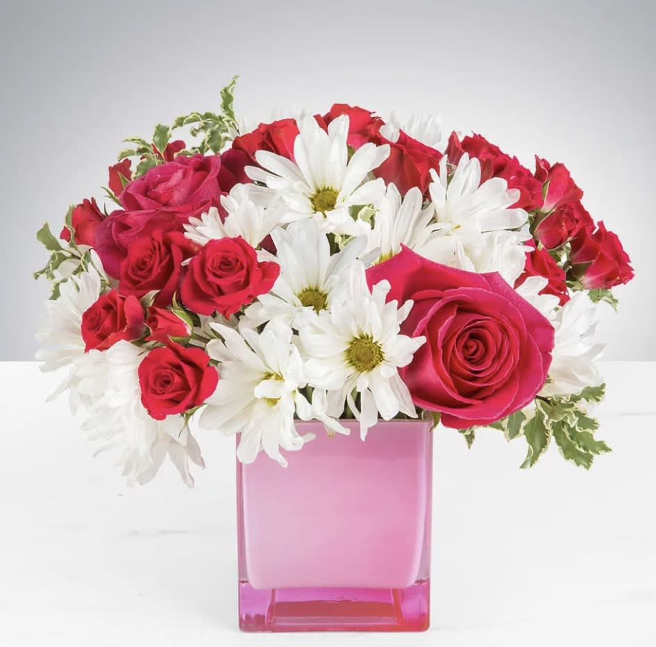 Daisy Me Rollin - This arrangement contains spray daisies and spray roses. This is a great birthday gift. APPROXIMATE DIMENSIONS: 9&quot;L X 9&quot;W x 9&quot;H  Please Note: The bouquet pictured reflects our original design for this product. While we always try to follow the color palette, we may replace stems to deliver the freshest bouquet possible, and we may sometimes need to use a different vase. 