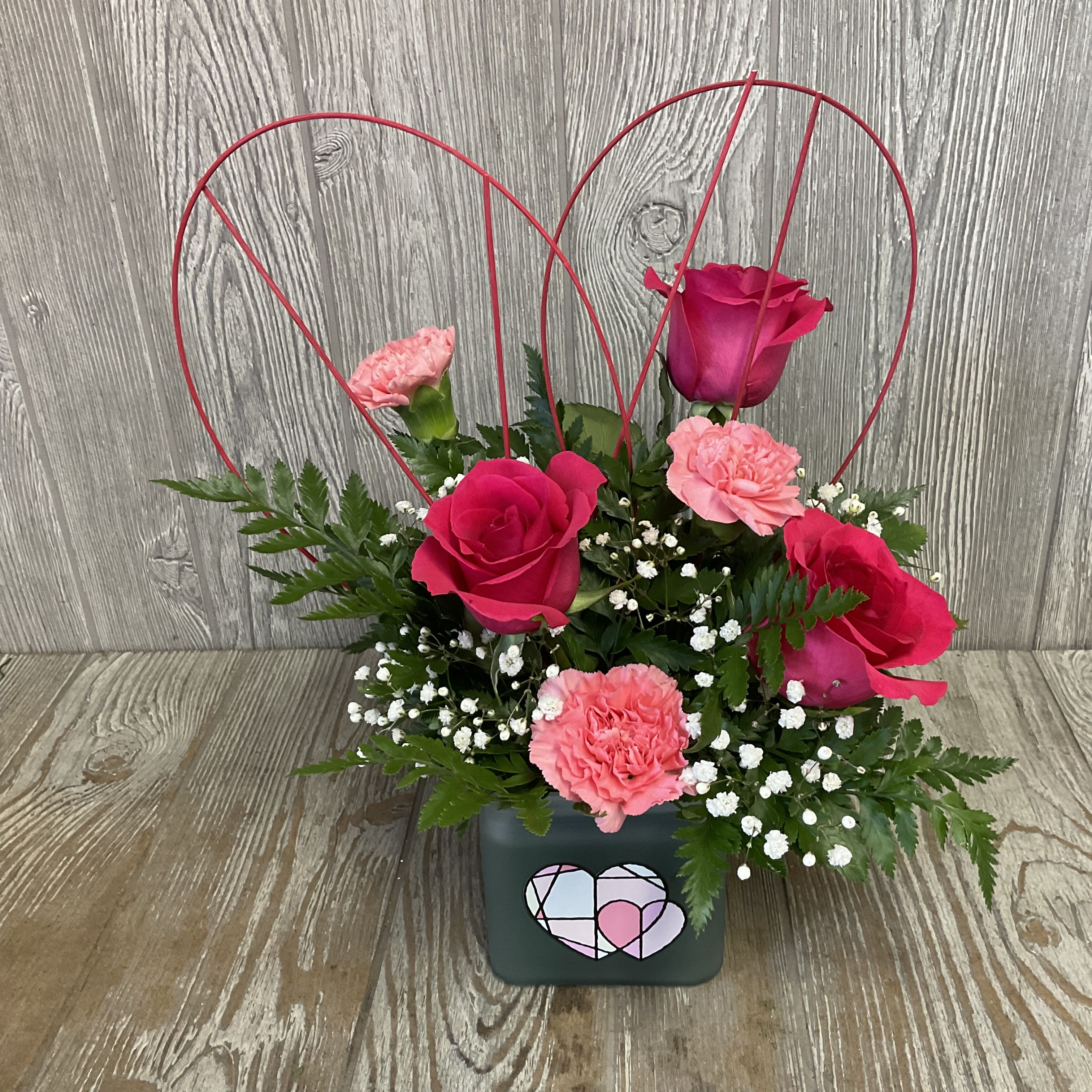 Geo Rose - Modern and beautiful arrangement of roses in a decorative, geometric heart container. Colors and flowers may vary. 