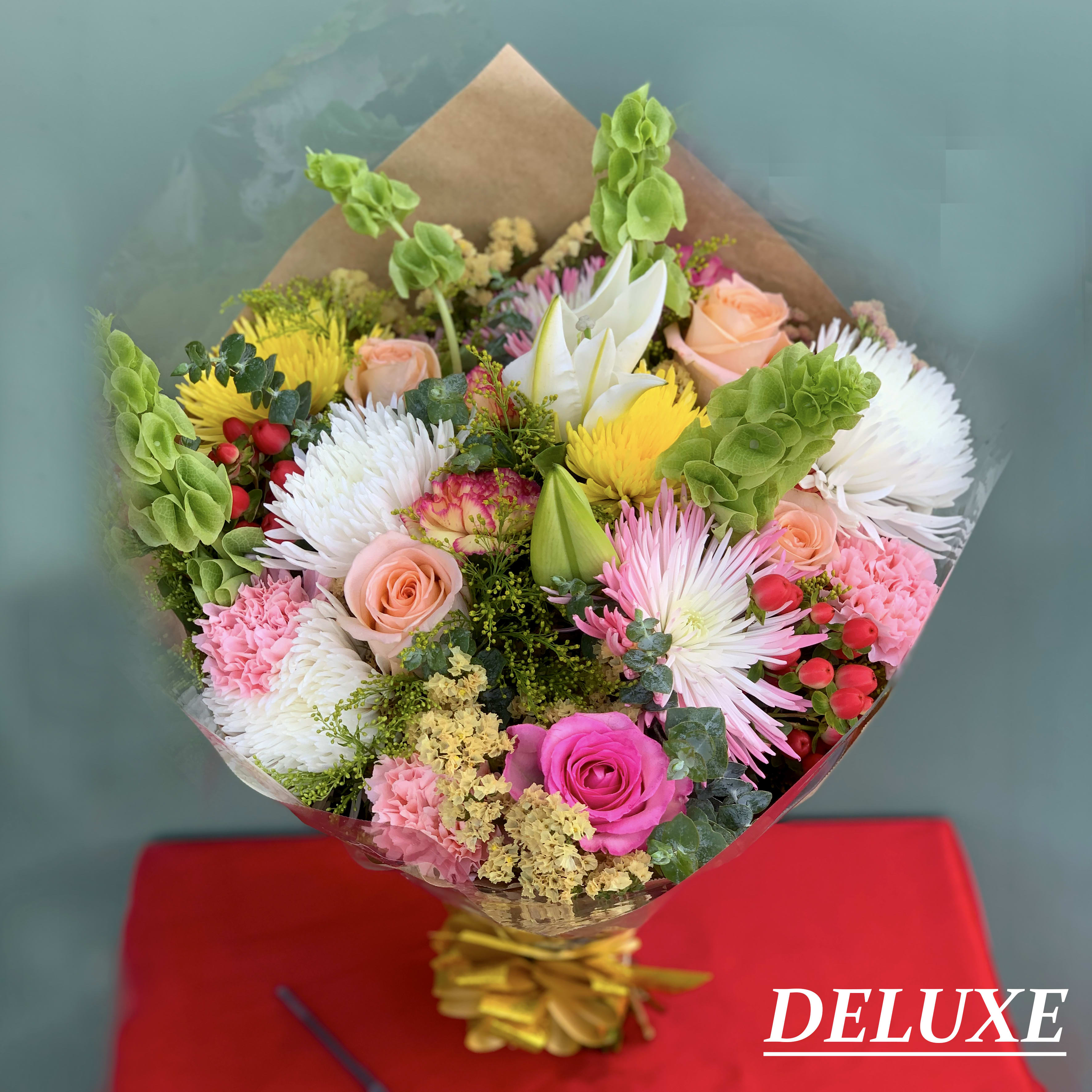 Summer Fun - Breath in the freshness of the summer aromatic bouquet of flowers filled with different colors and textures.  NOTE: THE PHOTO SHOWN IS DELUXE