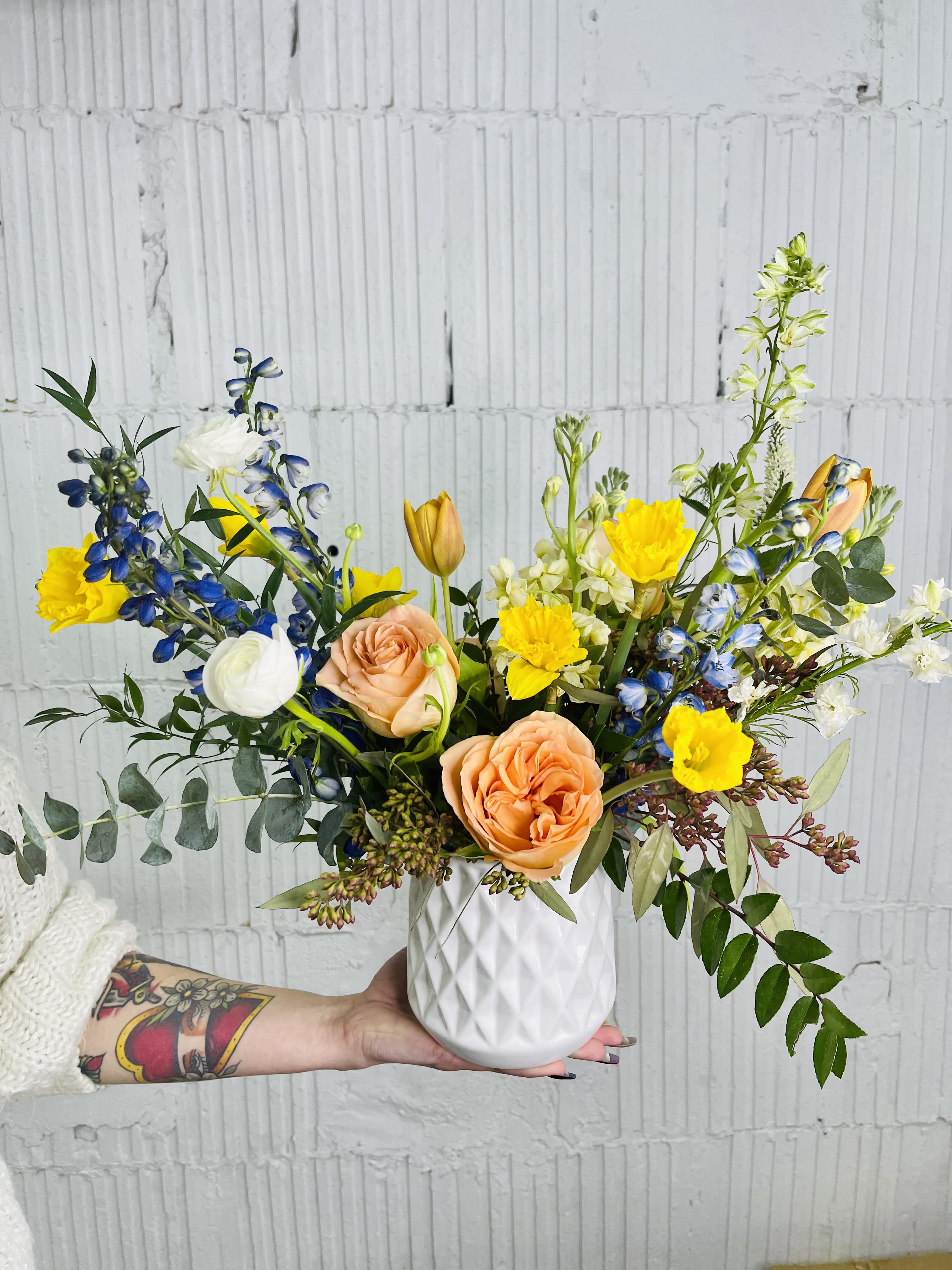 Felicity - A great choice to brighten someones day. Yellows, blues and peaches are arranged in a keepsake container. 