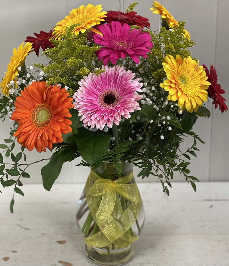 Gerbera Brights - Sending this bouquet just might be your brightest idea of the summer! Gerberas are so full of color, charisma and character, and this arrangement showcases their glory. 