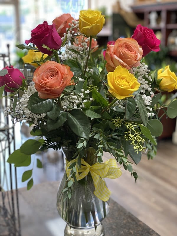 Unique Rose Mix - One dozen assorted color roses beautifully arranged in a glass vase