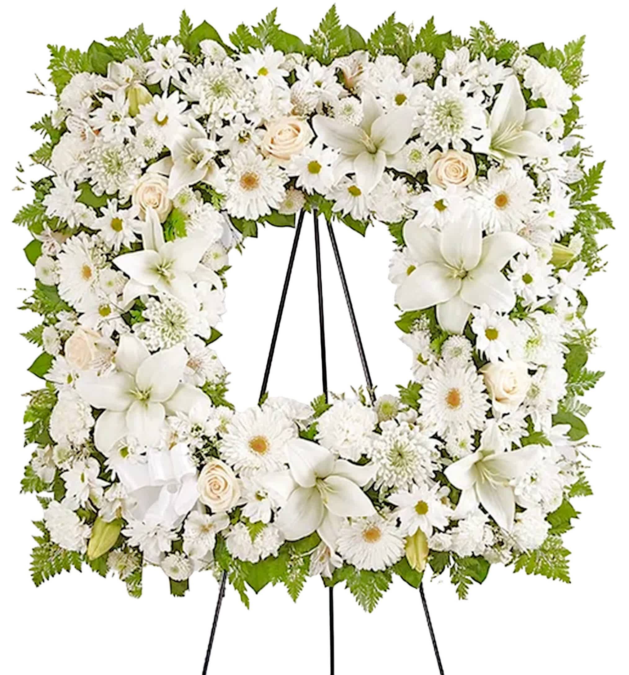 Sentimental Solace Square Wreath - White - Offer solace with a sentimental arrangement for the services. The square wreath features soothing white blooms &amp; greenery for a lush, full presentation. A photo can be displayed in the center, creating a unique and beautiful tribute to a cherished loved one. Appropriate for the funeral home, memorial service, or gravesite.  DETAILS White roses, Asiatic lilies, alstroemeria, gerbera daisies, mums, daisy poms, button poms, carnations, limonium, &amp; greenery.   EASEL INCLUDED  Orientation: One-Sided *If you would like to add a ribbon with a sentiment for an additional $10 each. *For larger photos, we recommend upgrading to the deluxe or premium. Item #NF-1117  FLORIST-TO-DOOR Same day flower delivery on most orders placed online by 12 pm or 10 am on weekends PST.  BLOOM DETAILS Roses Asiatic Lilies Gerbera Daisies Alstroemeria Carnations Daisy-Mums Button-Mums Cushion-Mums Limonium Greenery  The Standard Arrangement is approx. 31&quot;H x 31&quot;W without stand (SHOWN) (66&quot;H with easel) 18&quot;D The Deluxe Arrangement is approx. 33&quot;H x 33&quot;W without an easel (68&quot;H with easel) 20&quot;D The Premium Arrangement is approx. 35&quot;H x 35&quot;W without an easel (70&quot;H with easel) 22&quot;D  INSTRUCTIONS: 1.) Please have the business name of the funeral home, address &amp; phone number 2.) Please have the first name &amp; last name of the deceased 3.) Please have the start time of the services  NINFA'S FLOWERS 2405 WHITTIER BLVD. LOS ANGELES, CA. 90023