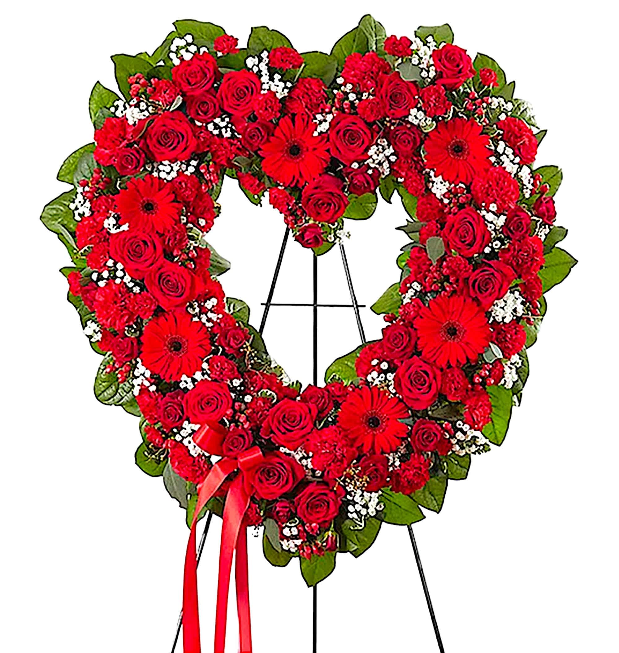Always Remembered Floral Heart Tribute - Red - The love for someone who has passed away lives on forever in the hearts of those left behind. This sentiment is best captured with a standing, open heart-shaped red floral arrangement. Handcrafted with an assortment of radiant red blooms, it is a magnificent tribute fitting for the funeral services, memorial service, or gravesite.  DETAILS Red roses, red spray roses, red gerbera daisies, red carnations, red mini carnations, and red hypericum; accented with baby’s breath and lush greenery.  EASEL INCLUDED Orientation: One-Sided *If you would like to add a ribbon with a sentiment for an additional $10 each. Item #NF-1007  FLORIST-TO-DOOR Same day flower delivery on most orders placed online by 12 pm or 10 am on weekends PST.   BLOOM DETAILS Roses Carnations Mini Carnations Hypericum Filler Greenery  The Standard Arrangement is approx. 26&quot;H x 28&quot;W without easel. (SHOWN) The Deluxe Arrangement is approx. 28&quot;H x 30&quot;W without an easel. The Premium Arrangement is approx. 30&quot;H x 32&quot;W without an easel.  INSTRUCTIONS: 1.) Please have the business name of the funeral home, address &amp; phone number. 2.) Please have the first name &amp; last name of the deceased. 3.) Please have the start time of the services.  How to place an order?  1. You can place an order directly on this secure website. OR 2. You can call in your order by dialing: (323) 262 - 9238. OR 3. You can visit our store (appointment recommended 323.262.9238)  NINFA'S FLOWERS 2405 WHITTIER BLVD. LOS ANGELES, CA. 90023
