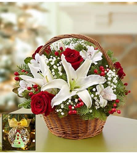 Christmas Basket with Lenox® Ornament Christmas Basket with Lenox® Ornament - Inspired by the traditional bouquets found in bustling European flower markets this time of year, our florists have hand-arranged the freshest red roses, white lilies and greens inside a charming handled basket. Filled with the classic colors of Christmas, our exclusive bouquet is a wonderful gift to thank the party hostess or to use as a centerpiece in your own holiday home. And the accompanying ornament by Lenox®, inspired by our perennial favorite Holiday Flower Tree® arrangement, sparkles with the glow of the meticulously detailed recreation inside.Arrangement of red roses, white lilies, alstroemeria, hypericum, gypsophilia and assorted fragrant Christmas greens in a willow handled basket; basket measures 8"H