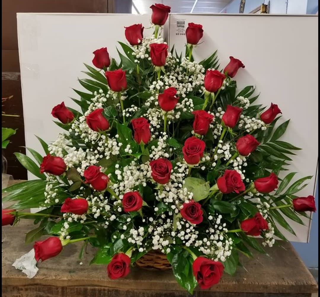 Roses are Red Basket Roses are Red Basket - 2 Dz beautiful Ecuadorian roses in a nice brown basket accented with baby's breath.