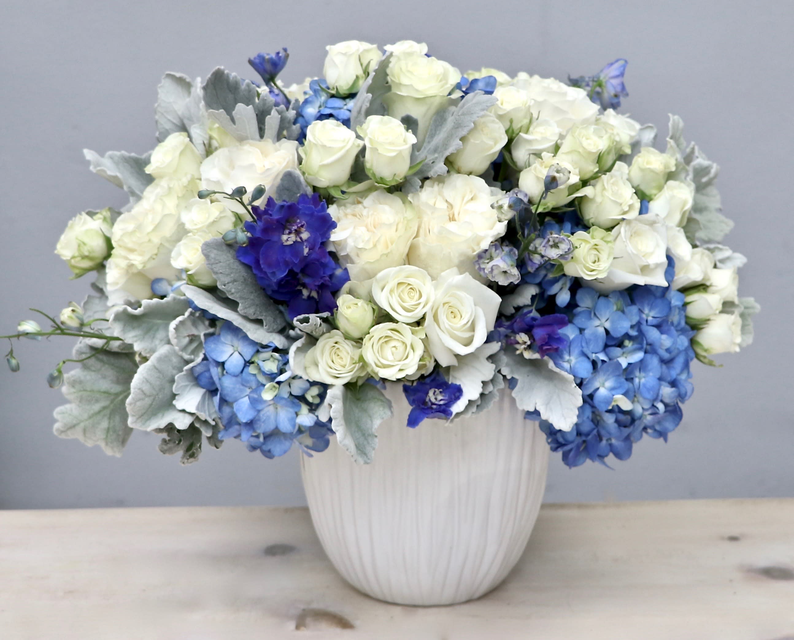 Winter Rose - My Glendale Florist  - You can't go wrong with this elegant and beautiful arrangement. It includes premium roses, blue hydrangeas and our favorite greenery. 