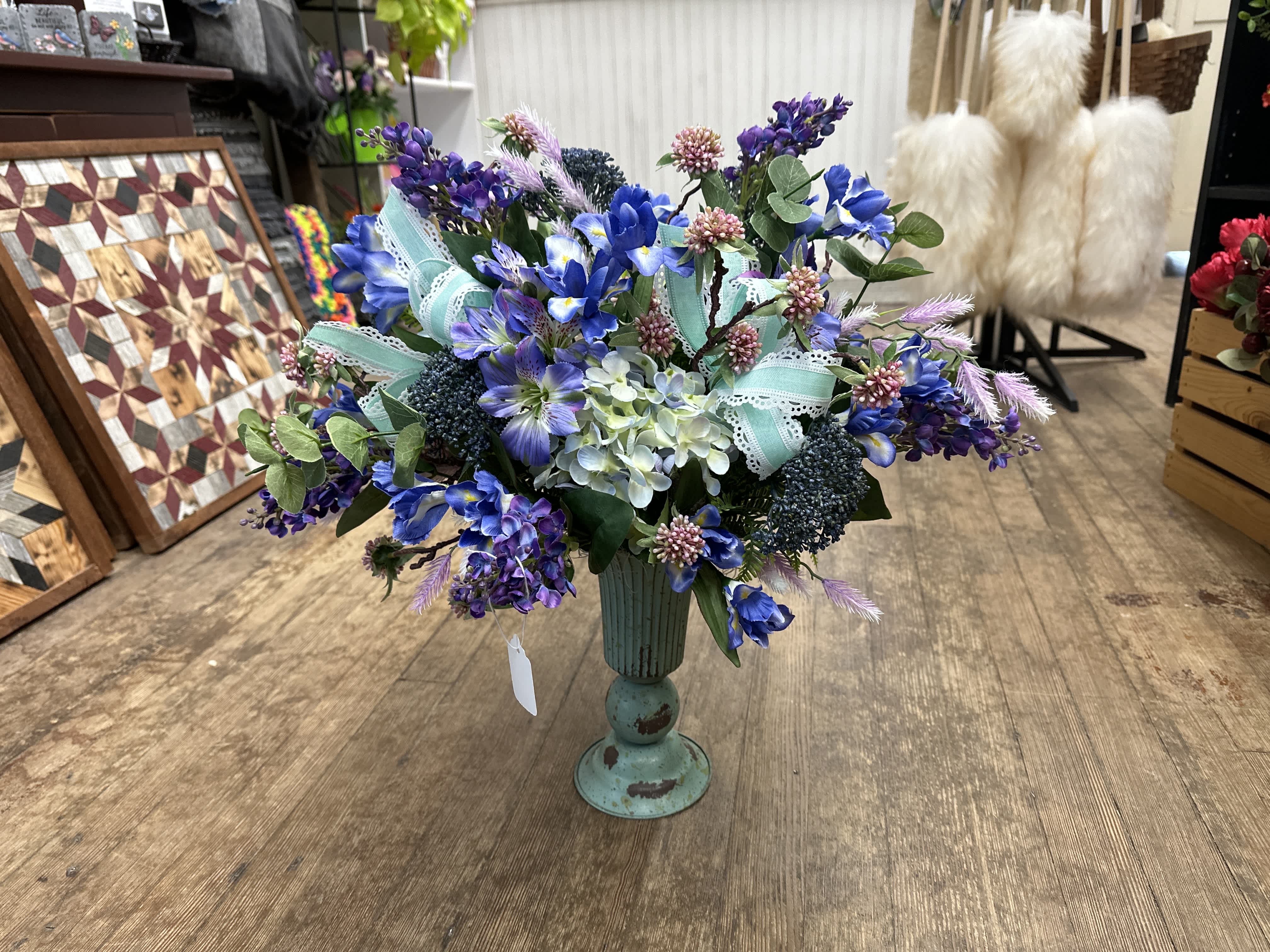 Blue purple artificial Blue purple artificial - Blue and purple ARTIFICIAL flowers in tall blue vase