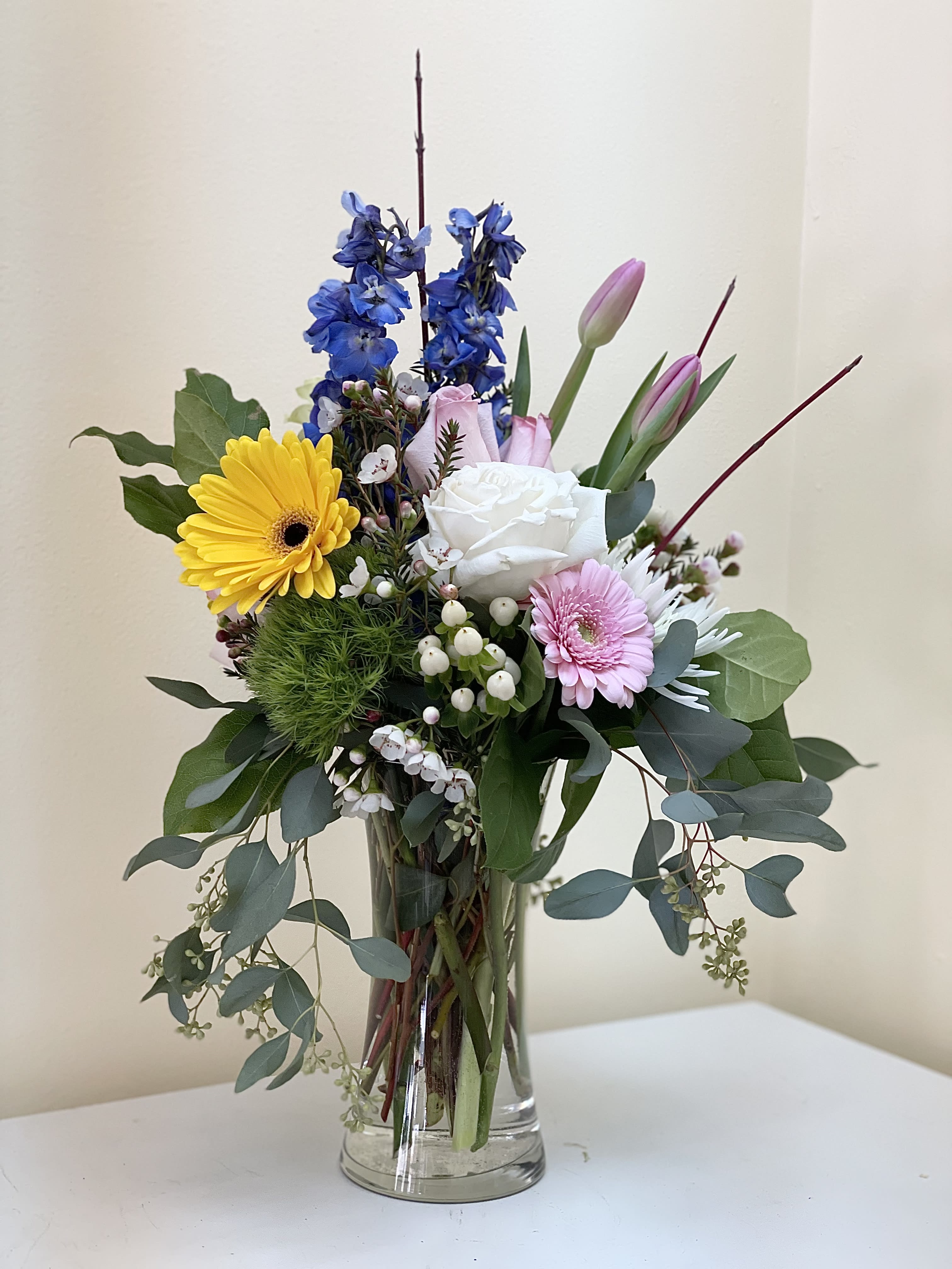 Delightful Color Delightful Color - A delightful arrangement with color and seasonal blooms and foliage, perfect for a desk.