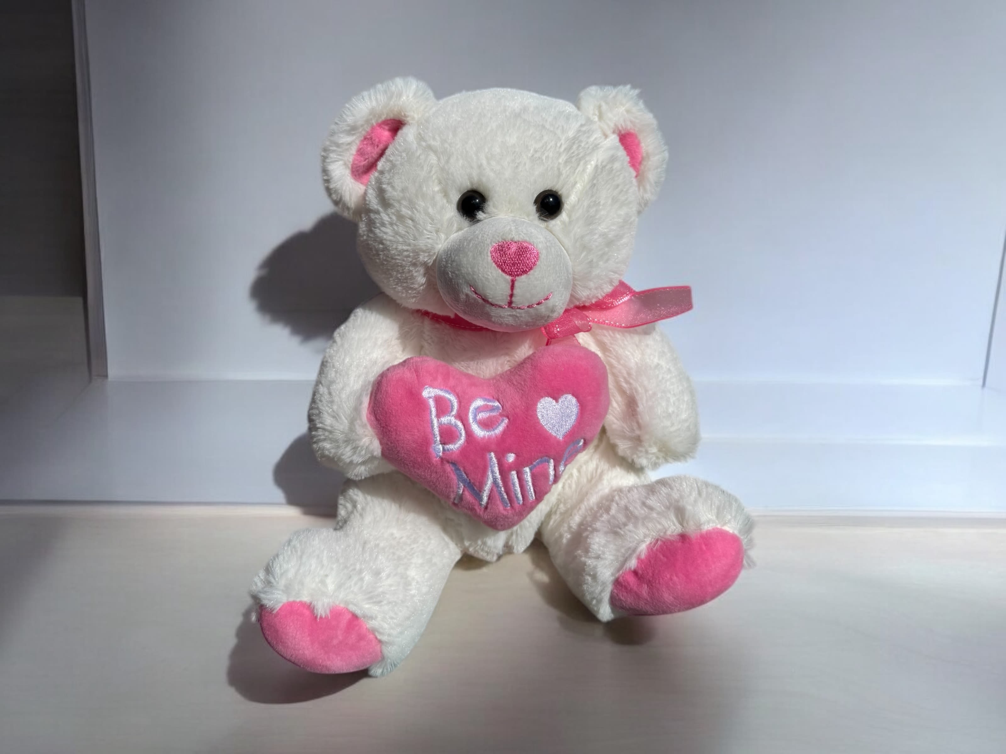Be Mine pink Teddy bear Be Mine pink Teddy bear - A cute pink and white Be Mine teddy bear. The bear is 10 inches tall and 8 inches wide sitting.