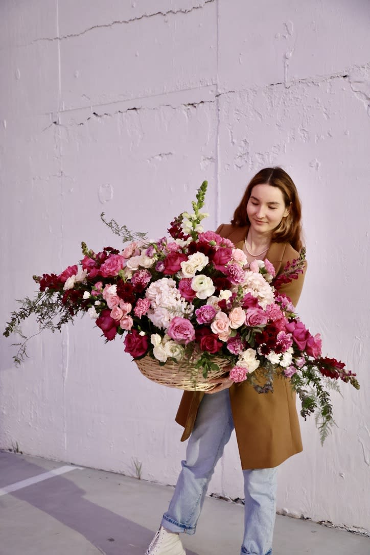 Pink Basket Large 3 Pink Basket Large 3 - A basket filled with pink flowers is a charming and romantic display that exudes grace and elegance. The basket is typically made of natural materials such as wicker, rattan, or wood, and is adorned with a beautiful array of pink blooms. The pink flowers used in the arrangement can include a variety of options such as roses, peonies, lilies, carnations, or any other pink blooms that complement each other in color and texture. The soft, delicate pink hues of the blooms create a sense of tranquility and calm, making it perfect for occasions such as weddings, birthdays, or as a gesture of love. The flowers are arranged in a loose and natural style, creating a sense of movement and flow within the basket. The basket itself adds a touch of rustic charm to the display, and is often adorned with additional elements such as ribbons, bows, or other decorative accents. The size and shape of the basket can vary depending on personal preference or the occasion. It can be a small, delicate arrangement perfect for a coffee table, or a larger, more grand display that is perfect for a wedding or other special event. Overall, a basket filled with pink flowers is a stunning and unforgettable display that will bring joy and happiness to any occasion. Its beauty and elegance will be appreciated by all who see it, and it will create a sense of romance and charm in any setting.
