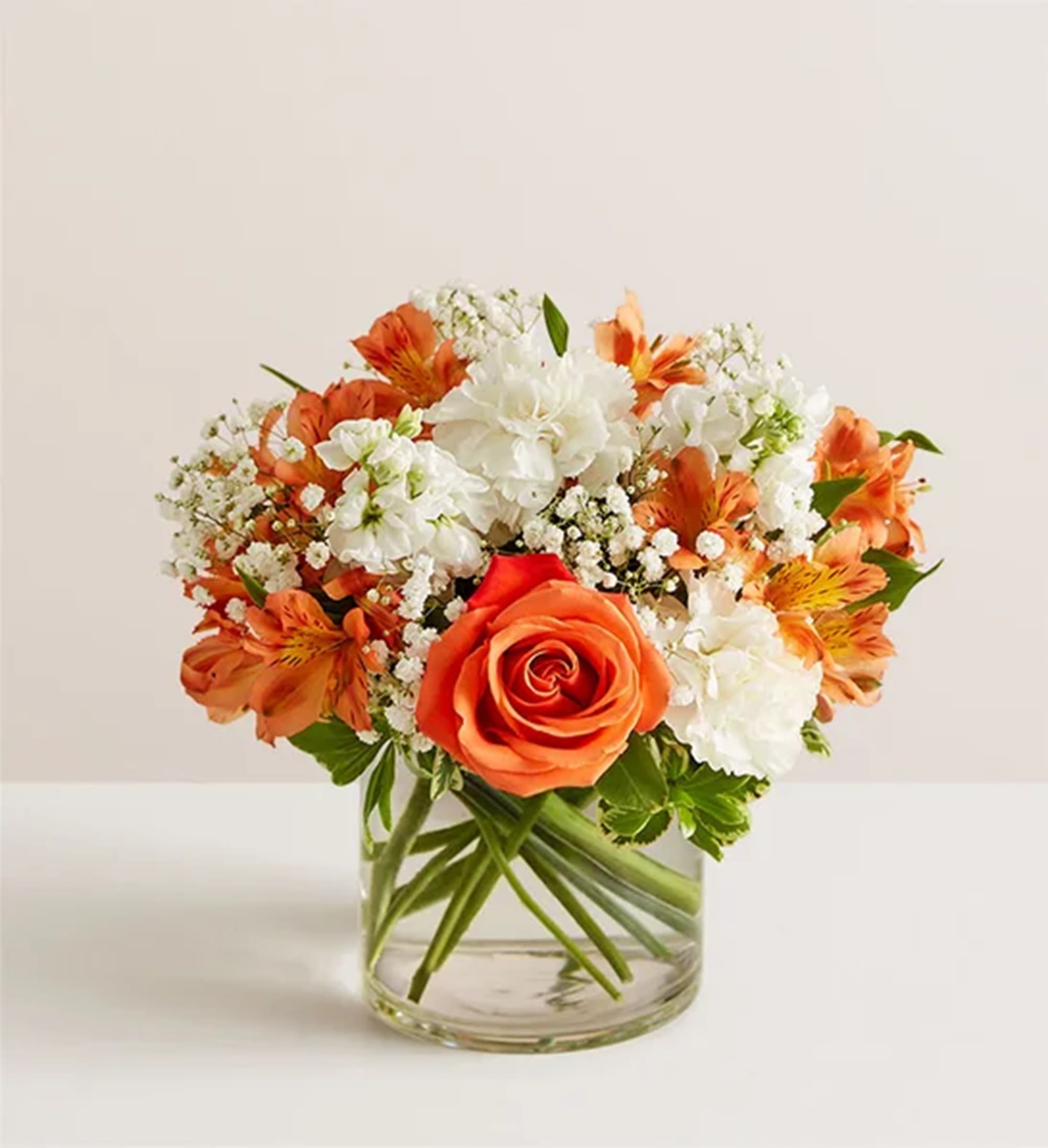 Loving Sentiments Orange, &amp; White - Convey your sincere condolences our elegant bouquet. Loosely gathered mix of warm orange &amp; soothing white blooms brings comfort &amp; love, while reminding them that brighter days are ahead. Appropriate for the home of family members or friends, memorial reception, or other occasions.  DETAILS All-around arrangement with orange roses &amp; alstroemeria; white carnations &amp; stock; accented with baby’s breath, &amp; greenery; artistically designed a clear glass cylinder vase  VASE INCLUDED Orientation: All-Around Item #NF-1326  FLORIST-TO-DOOR Same day flower delivery on most orders placed online by 12 pm or 10 am on weekends PST.  BLOOM DETAILS Roses Carnations Alstroemerias Stock Baby's Breath Greenery  The Standard Arrangement is approx. 12&quot;H x 9&quot;W The Deluxe Arrangement is approx. 12&quot;H x 10&quot;W The Premium Arrangement is approx. 12&quot;H x 11&quot;W  How to place an order? 1. You can place an order directly on this secure website OR 2. You can call in your order by dialing: (323) 262 - 9238 OR 3. You can visit our store (appointment recommended 323.262.9238)  NINFA'S FLOWERS 2405 WHITTIER BLVD. LOS ANGELES, CA. 90023  ATTENTION: *Please note that on busy holidays, Valentine's Day, and Mother's Day, we cannot verify if the recipient received the flowers until the following day. You can verify delivery on the website after 10:00 pm, call 323.262.9238 the following day after 10:00 am, or contact the recipient directly. Thank you for your patience and understanding.