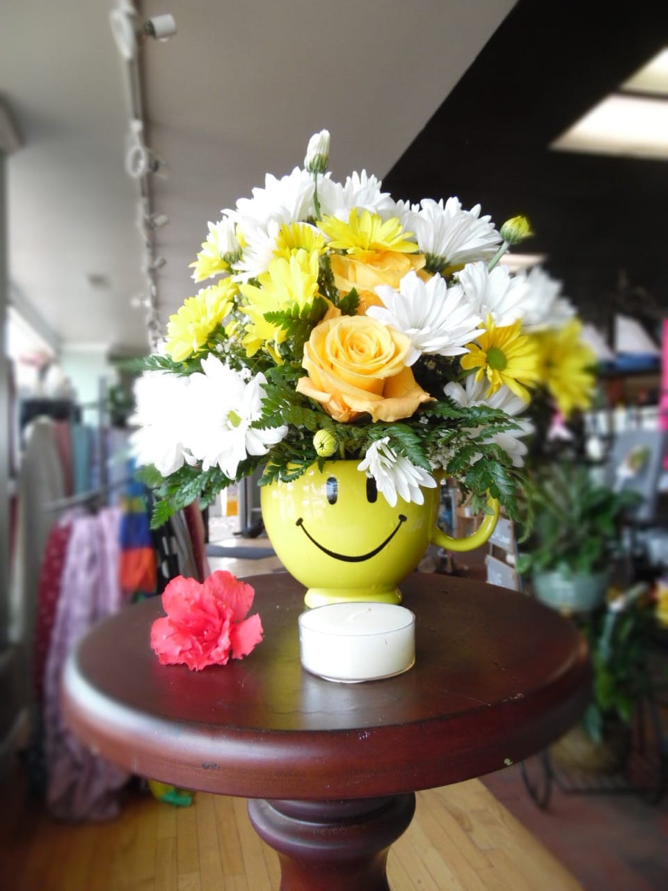 Teleflora's Be Happy Bouquet With Roses  - There are probably a million reasons this is such a popular bouquet. Of course, there are probably just as many reasons to send this cheerful arrangement. Full of happy flowers, this ceramic happy face mug will bring smiles for years to come. Especially when filled with that first cup of morning coffee or cocoa!