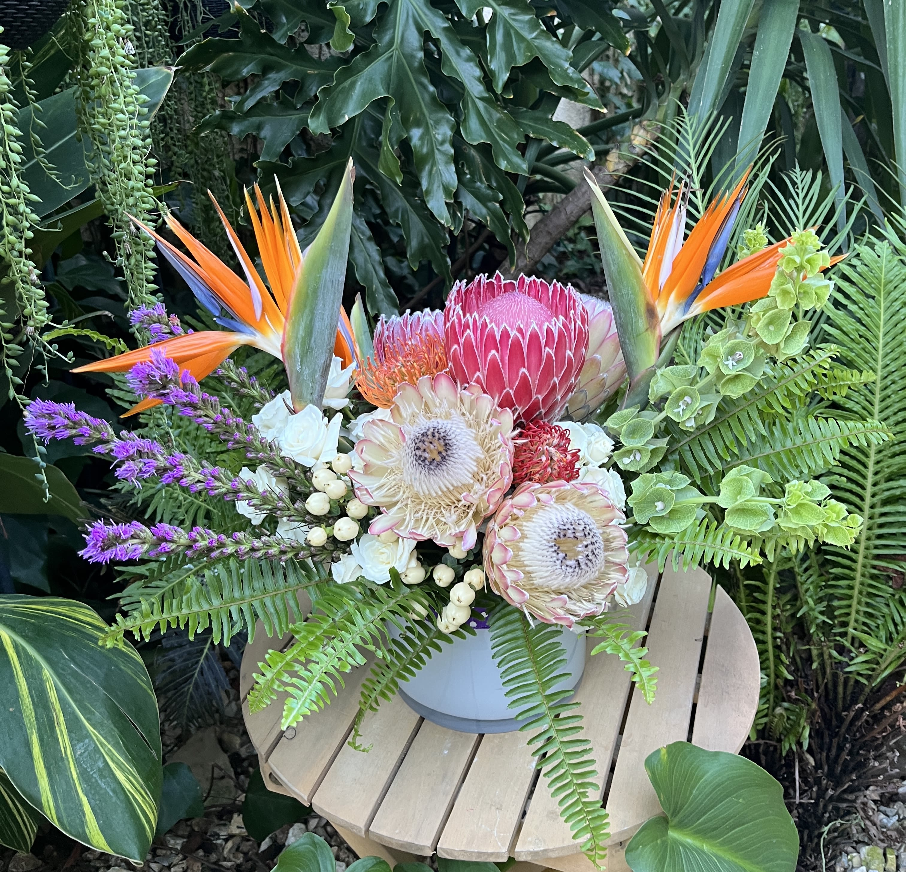 Tropicana Tropicana - This arrangement must be purchased by phone or using our Custom Arrangements section due to our use of flowers that are only available in certain seasons or can only be obtained with orders placed in advance.