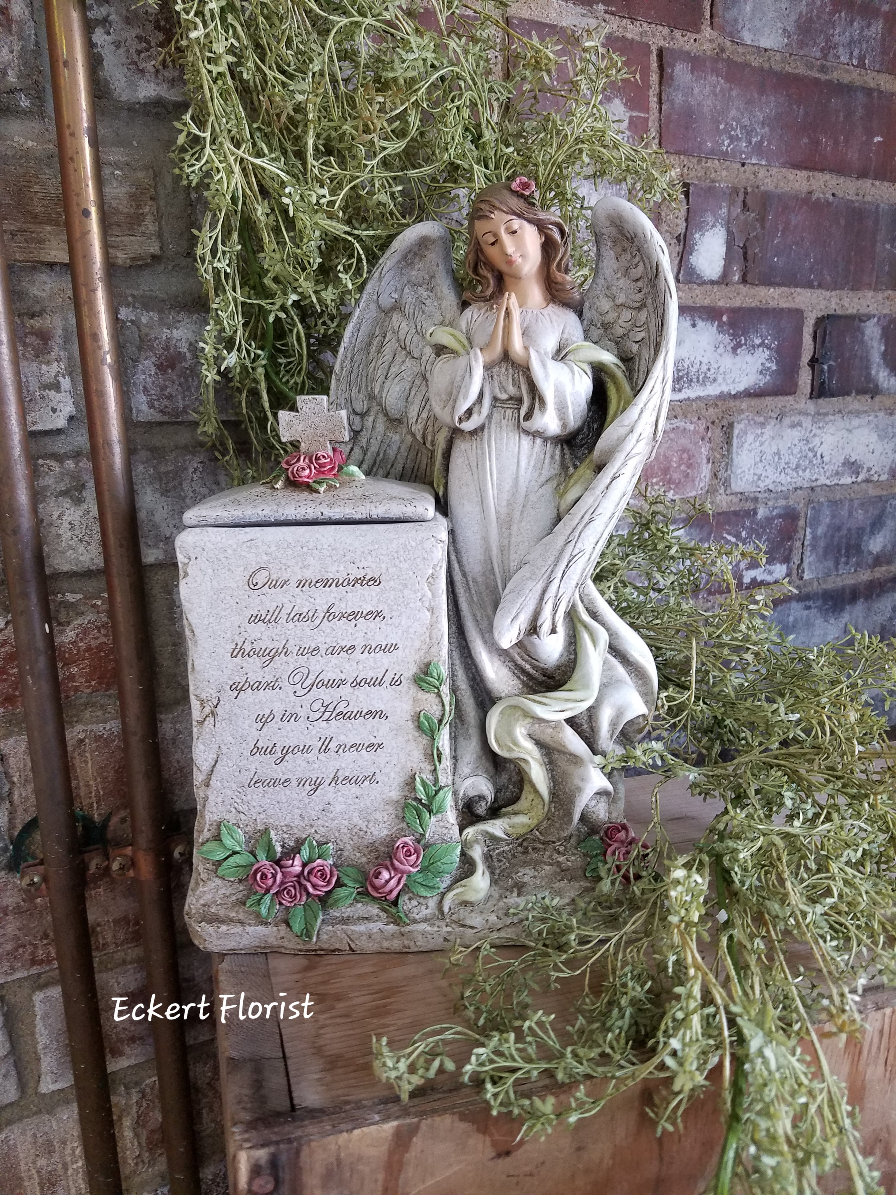 Eckert Florist's Praying Angel 2 With Memory Box Eckert Florist's Praying Angel 2 With Memory Box - Resin angel with memory box measures approx. 7.5" W X 11.5" H. Inscription on box: "Our memories will last forever, though we are now apart. Your soul is up in heaven, but you'll never leave my heart." *LOCAL DELIVERY ONLY