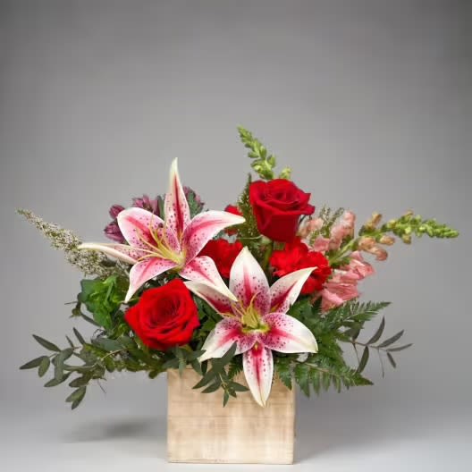 Sweetest Symphony - Celebrate love this Valentine's Day with our exquisite arrangement, Sweetest Symphony, featuring elegant lilies and romantic roses, beautifully presented in a charming white wood box. This stunning bouquet combines the delicate grace of lilies with the timeless beauty of roses, making it the perfect gift for your beloved.  At Hignight Florist in East Moline, Illinois, we pride ourselves on offering the freshest flowers that are artfully arranged to convey your heartfelt sentiments. Our Valentine's Day collection is designed to create memorable moments, whether you're surprising a partner, expressing affection to a friend, or celebrating a special milestone.  Order your Sweetest Symphony arrangement today and enjoy same-day delivery across East Moline and the surrounding areas. Embrace the spirit of love and let Hignight Florist help you make this Valentine's Day unforgettable!