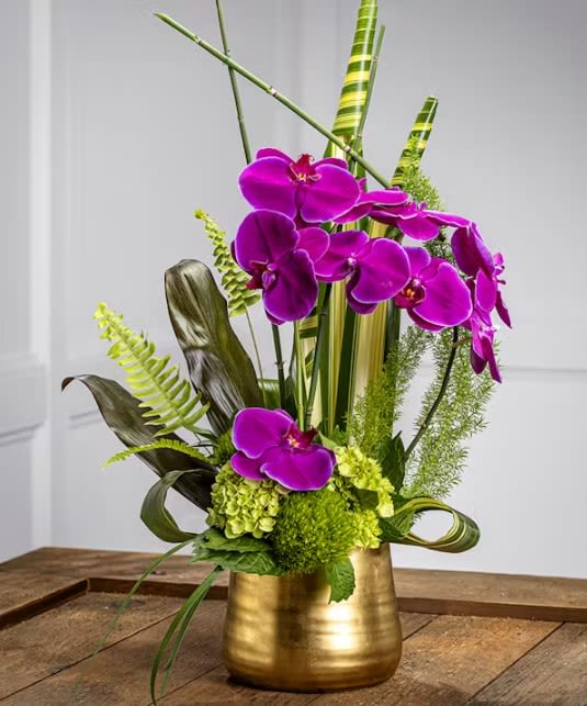 Inspiration Inspiration - A Contemporary and modern presentation of exotic purple orchids amid lush tropical foliage. Guaranteed to inspire the imagination and delight the senses. A perfect floral display for an entry way, hall, pedestal or reception table. Our arrangements are unique, custom gifts designed by hand. Mother Nature changes our farm-fresh inventory every morning; to assure your gift is fresh and gorgeous our artists may need to make substitutions but will capture the color & style of your selection to deliver a "WOW" for your recipient.