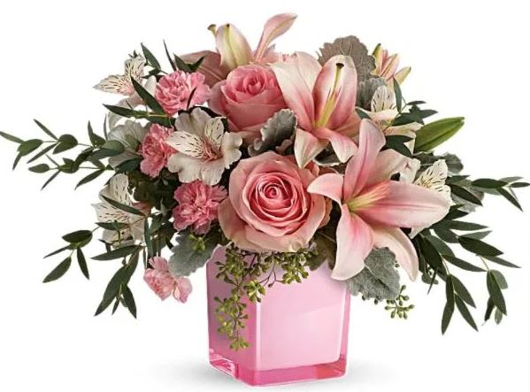 Fabulous Flora Bouquet Fabulous Flora Bouquet - A fabulously divine way to declare your love, or simply brighten a special someone's day, this pinktastic bouquet of roses and lilies is perfectly paired with a perky pink cube vase. This gorgeous bouquet features pink roses, pink asiatic lilies, white alstroemeria, pink miniature carnations, dusty miller, parvifolia eucalyptus, and seeded eucalyptus. Delivered in a Rose Color Splash Cube. Orientation: All-Around All prices in USD ($) Due to an increase in the cost of roses, some product prices may be impacted during the Valentine’s delivery period.