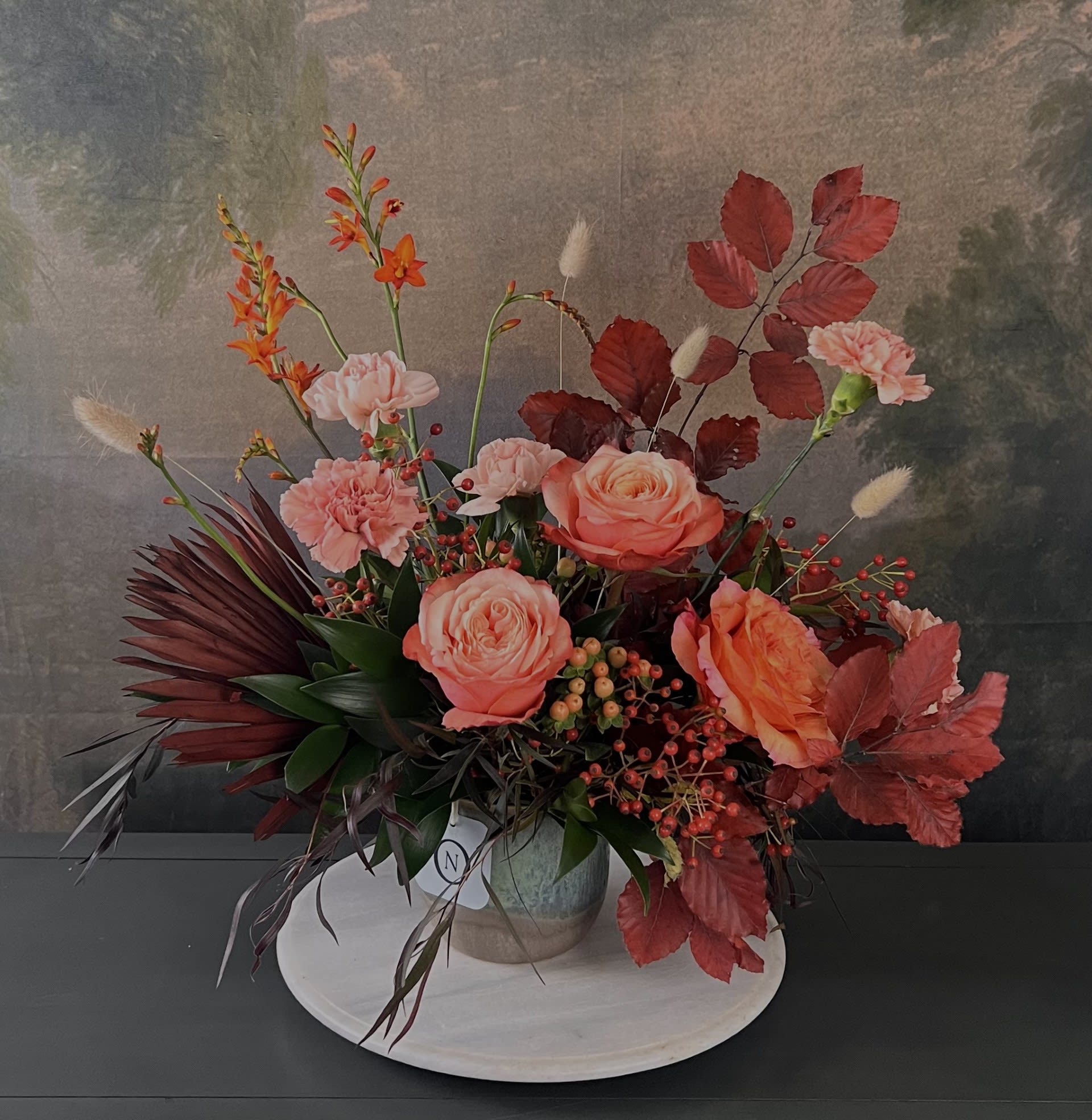 Emma - Bring the Fall season into your home! Designed with beautiful, seasonal materials, this arrangement is guaranteed to impress family, friends, or guests. Don’t let the season pass you by!  Flowers and greenery may vary due to seasonal availability, but that’s part of the charm! Our creative designers will substitute with the freshest high end product available- some grown in our very own garden!- and create something beautiful.  *Have a special request?* Let us know in the special instructions section during checkout.