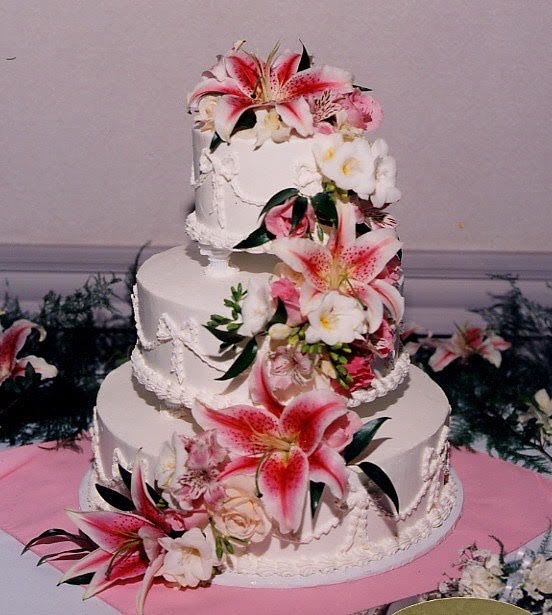 Wedding/Event flowering for cakes and other deserts - Starting at $100.00. Customizable decorating for special event deserts. Please note that the flowers are not edible and this flower shop is not responsible for any incidents regarding the chance of a flower being consumed purposefully or accidentally. For any further inquiries please contact the shop.