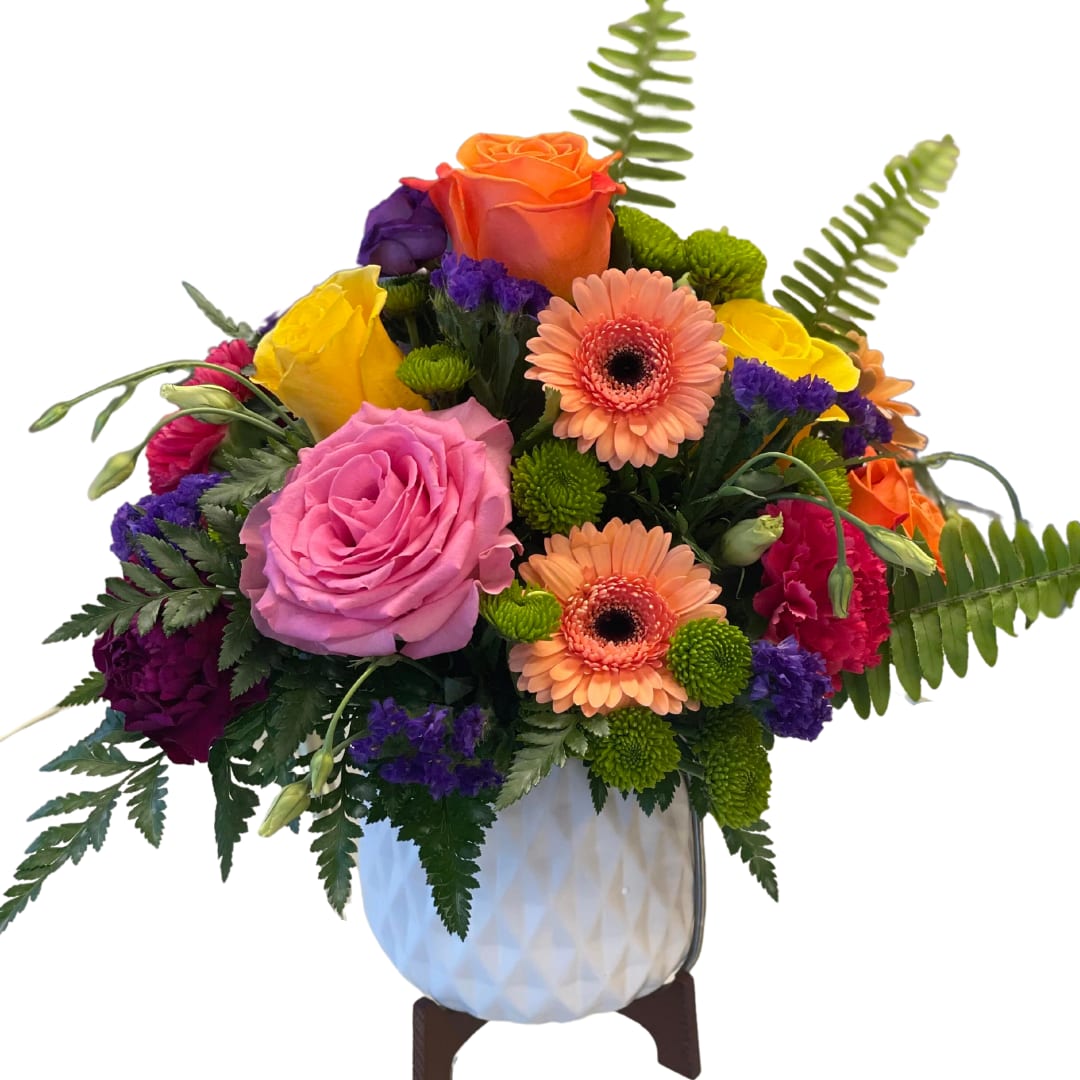 Breezy Bright's - Bring a refreshing touch of nature into your space with our Breezy Bright's arrangement. Featuring a mix of colorful blooms, this arrangement is the perfect way to add a burst of energy and beauty to any room. The modern ceramic vase adds a touch of elegance and sophistication to the overall design.  Each Breezy Bright arrangement is thoughtfully curated with a mix of high-quality blooms, expertly arranged by our experienced florists. The overall effect is a beautiful, natural display that is both calming and invigorating.  Perfect for any occasion or simply to brighten up your day, Breezy Bright is a versatile and stylish choice. Add it to your home decor or give it as a gift to someone special – either way, it's sure to make a lasting impression.  Order your Breezy Bright arrangement today and experience the beauty and joy of fresh, expertly crafted floral arrangements.