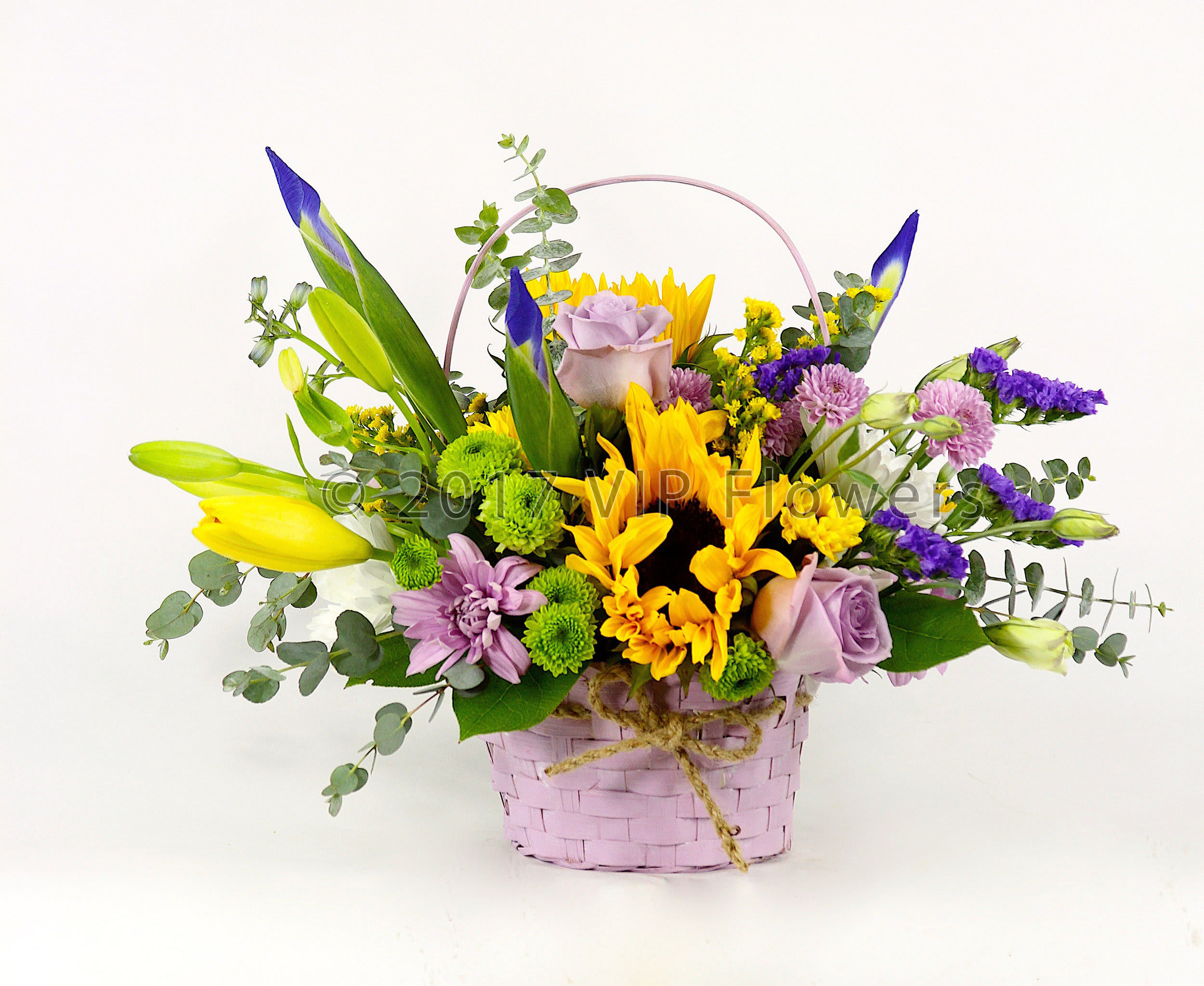 BEAUTIFUL Basket - Flowers Included:  Sunflowers Yellow Lilies Iris Statice Green Mums Purple Mums Seasonal Flowers Seasonal Greens       Substitutions may be necessary to ensure your arrangement or specialty gift is delivered in a timely manner. The utmost care and attention is given to your order to ensure that it is as similar as possible to the requested item (Please note that some flowers and colors may vary due to seasonality.)