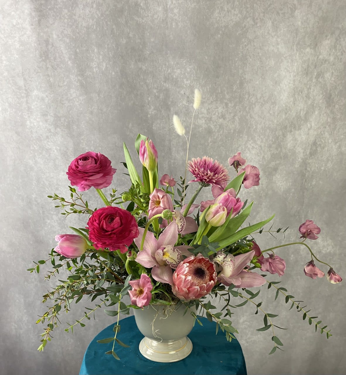 Maeve - Perfectly pink, this cheerful design is perfect for any occasion and features the season’s freshest high end product. Certain to wow that special someone for birthdays, anniversaries, or anything in between!  Flowers and greenery may vary due to seasonal availability, but that’s part of the charm! Our creative designers will substitute with the freshest high end product available- some grown in our very own garden!- and create something beautiful.  *Have a special request?* Let us know in the special instructions section during checkout.