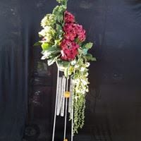 Windchimes with Silk Flowers Windchimes with Silk Flowers - Windchimes on a display and a variety of silk flowers