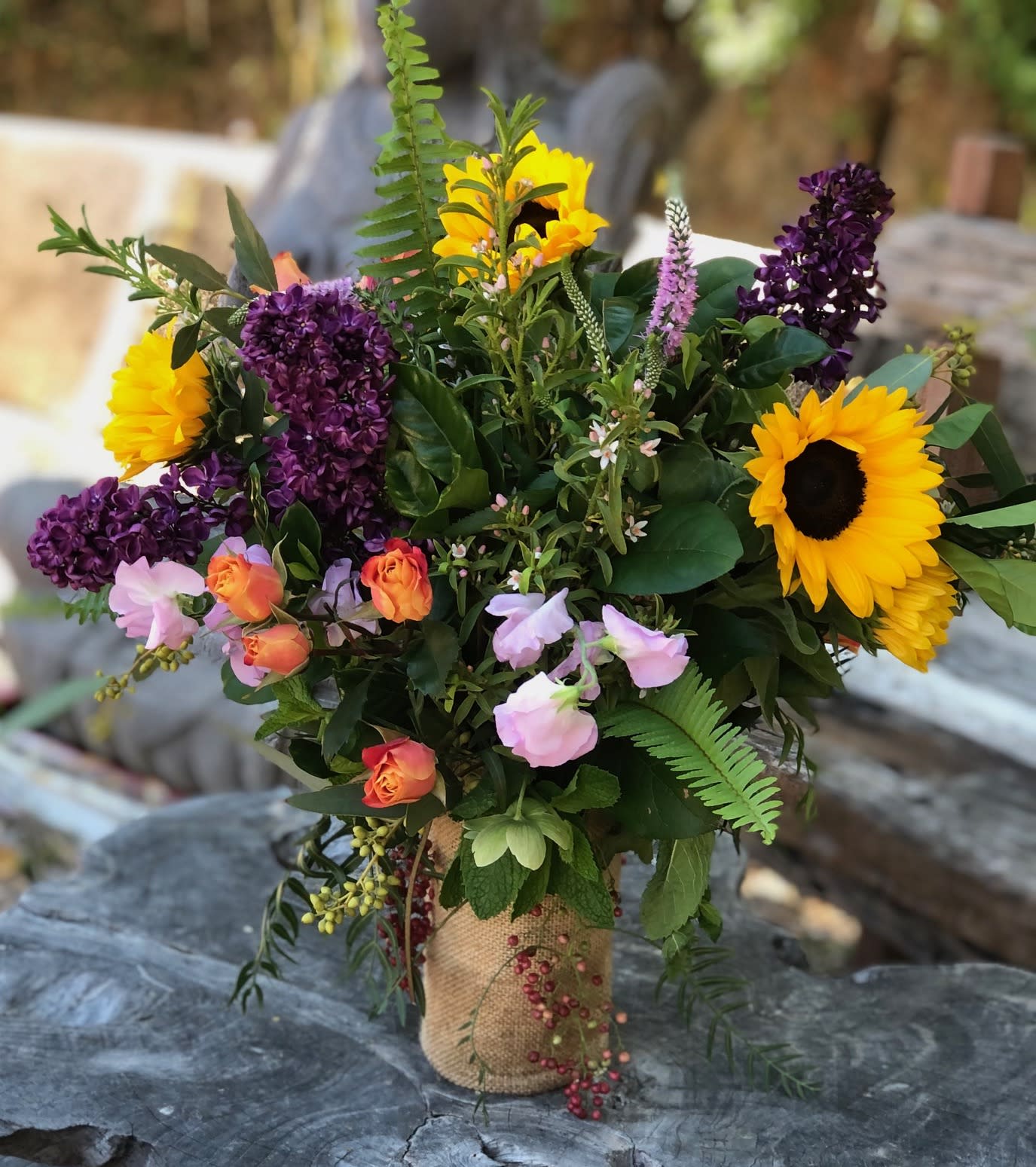 A Day in Topanga - This tall full arrangement offers a bold beautiful mix of color and texture in a burlap covered vase.  Perfect for any occasion, as a birthday gift or just to let someone know you are thinking of them.