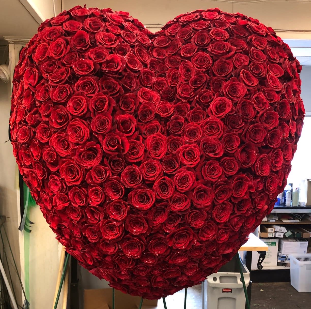 Red Rose Traditional Bleeding Heart - The traditional bleeding heart is a beautiful display expressing your profound affection for your loved one. This large beveled heart is designed with red roses.
