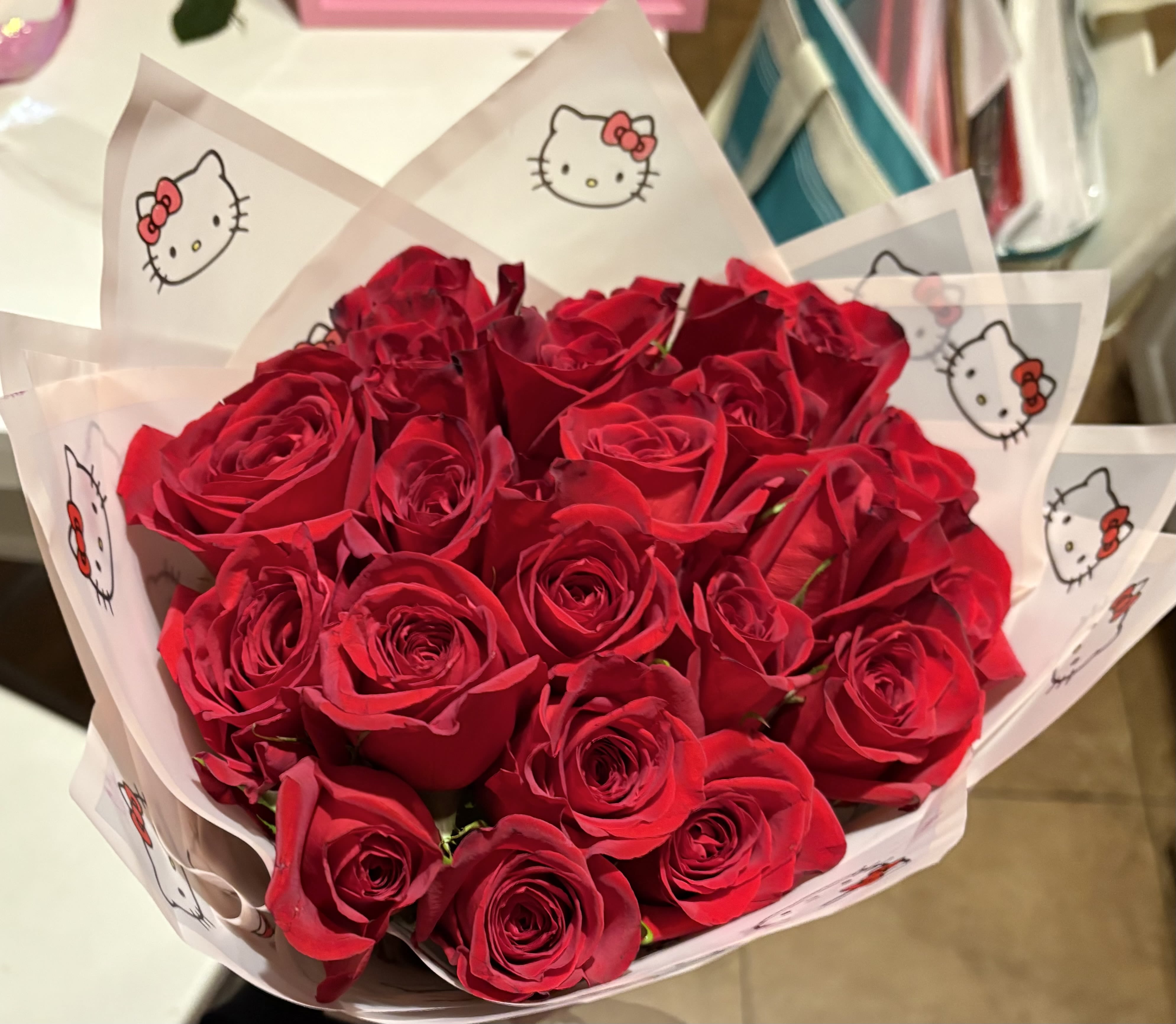 hello kitty bouquet hello kitty bouquet - 2 dozen red roses hand tied and wrapped with hello kitty kraft paper and a bow