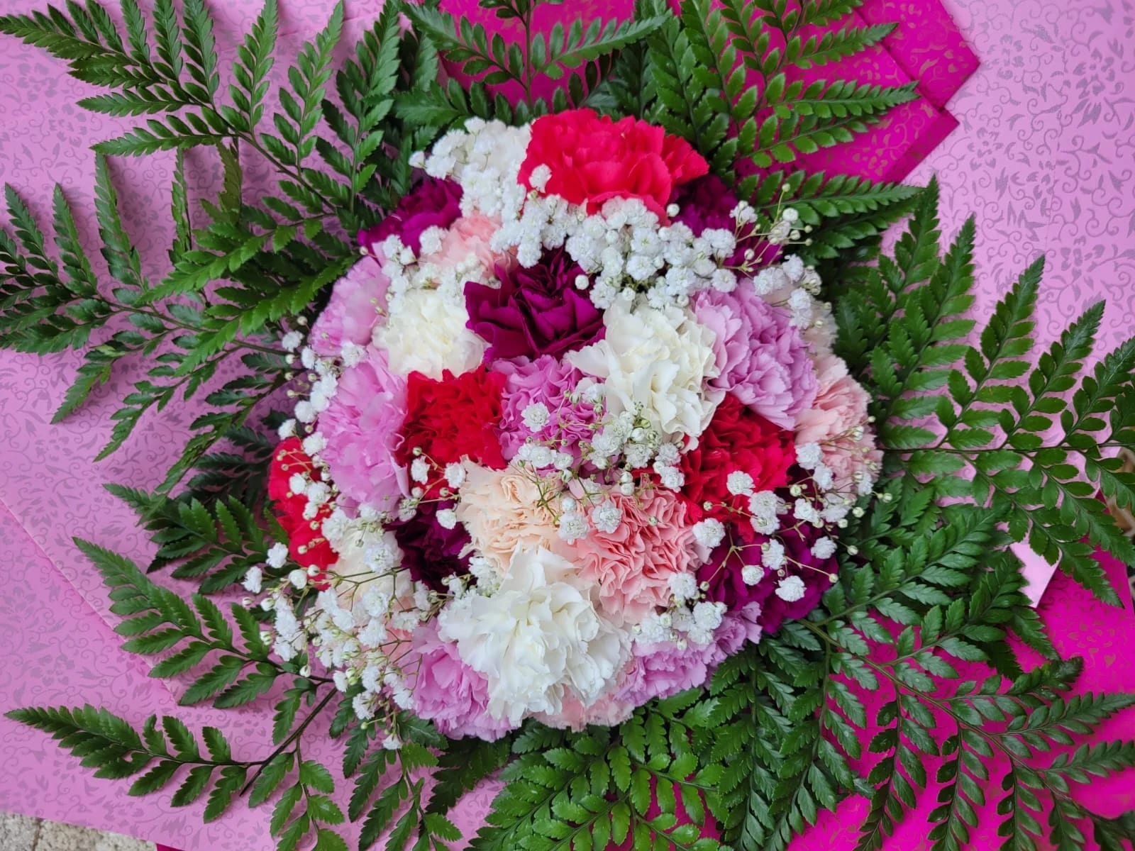 Carnations Buchon Carnations Buchon - Hand bouquet of carnations "Picture is a reference every arrangement would not be exactly the same. Color Substitution may apply. Flowers and color substitution may apply"