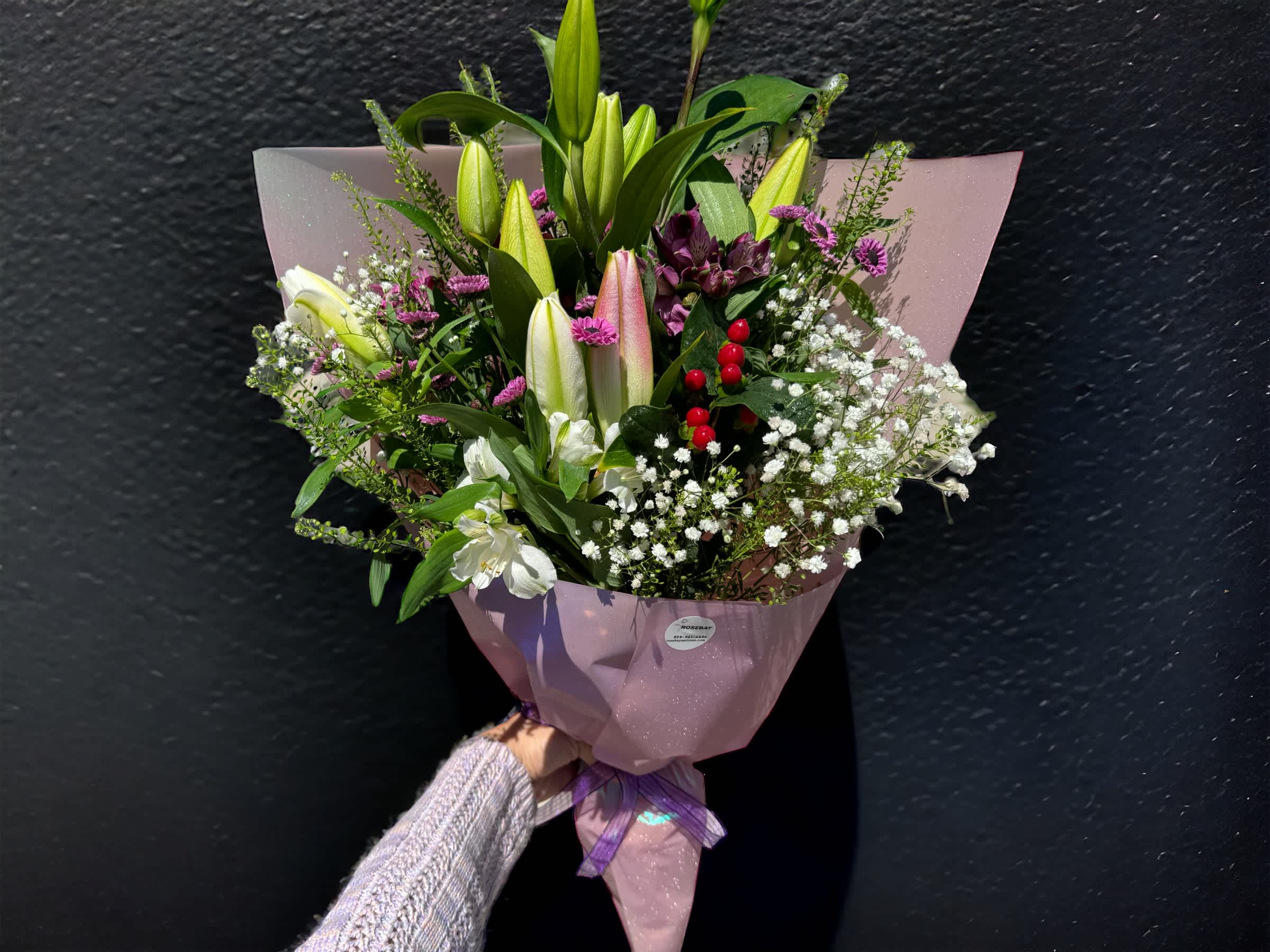 Lily bouquet - A bouquet of 3 long stem lilies and other seasonal flowers. Deluxe is 6 long stem lilies. Premium is 10 long stem lilies. **Color and variety of lily may vary** We offer different colors and styles for wrapping paper. Please note in Florist Instructions your choice of wrapping paper. We have one solid color like red, pink, white, classic brown, clear, etc. We also have two side colors like white/gold, light pink/hot pink, pink/purple, blue/white etc. And lastly, we have them in shiny/iridescent colors, or texture/style paper. Call us at 323-961-6686 if you have any questions.