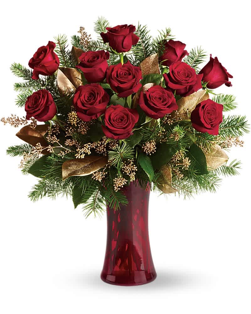 A Christmas Dozen A Christmas Dozen - Dazzling and delightful. A dozen red roses make a dashing holiday gift, especially when they are arranged with brilliant holiday touches and delivered in a ruby red vase. Twelve beautiful rose blossoms mix with salal, eucalyptus and golden fir branches in a radiantly red glass vase.