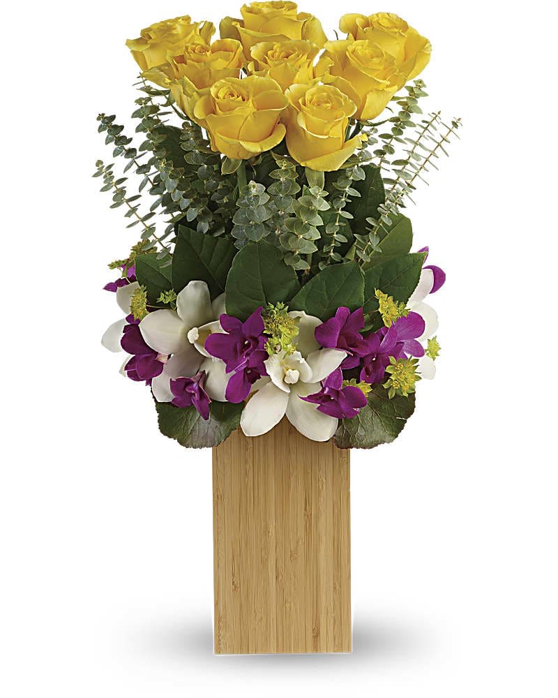 Teleflora's Burst Of Sunshine Bouquet Teleflora's Burst Of Sunshine Bouquet - An island-inspired burst of sunshine and happiness, this beautiful bouquet of yellow roses and colorful orchids is a gift they won't soon forget. This unique bouquet features white cymbidium orchids, purple dendrobium orchids, yellow roses, spiral eucalyptus, galax leaves, and lemon leaf. Delivered in a natural bamboo vase.