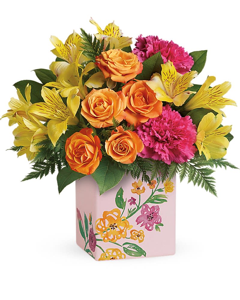 Teleflora's Painted Blossoms Bouquet Teleflora's Painted Blossoms Bouquet - Mom is so special, she deserves two bouquets! Shower her in blossoms with this bright, joyful arrangement of orange roses, yellow alstroemeria and pink carnations. Carefully arranged in a keepsake ceramic cube, decorated with its own painterly blooms, it's a Mother's Day surprise she'll always remember. Orange spray roses, yellow alstroemeria and pink carnations are arranged with leatherleaf fern and lemon leaf. Delivered in a Painted Blossoms cube.