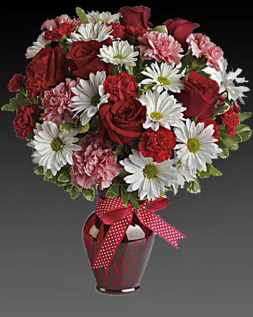 Hugs and Kisses Bouquet with Red Roses - Whether for your significant other or your sister, aunt or grandmother, this delightful floral gift is a sweet way to say &quot;I love you.&quot; Sweet price, too. The charming bouquet includes white daisy spray chrysanthemums, pink carnations, red miniature carnations and red roses accented with fresh greenery. Delivered in a stylish red vase. Orientation: All-Around