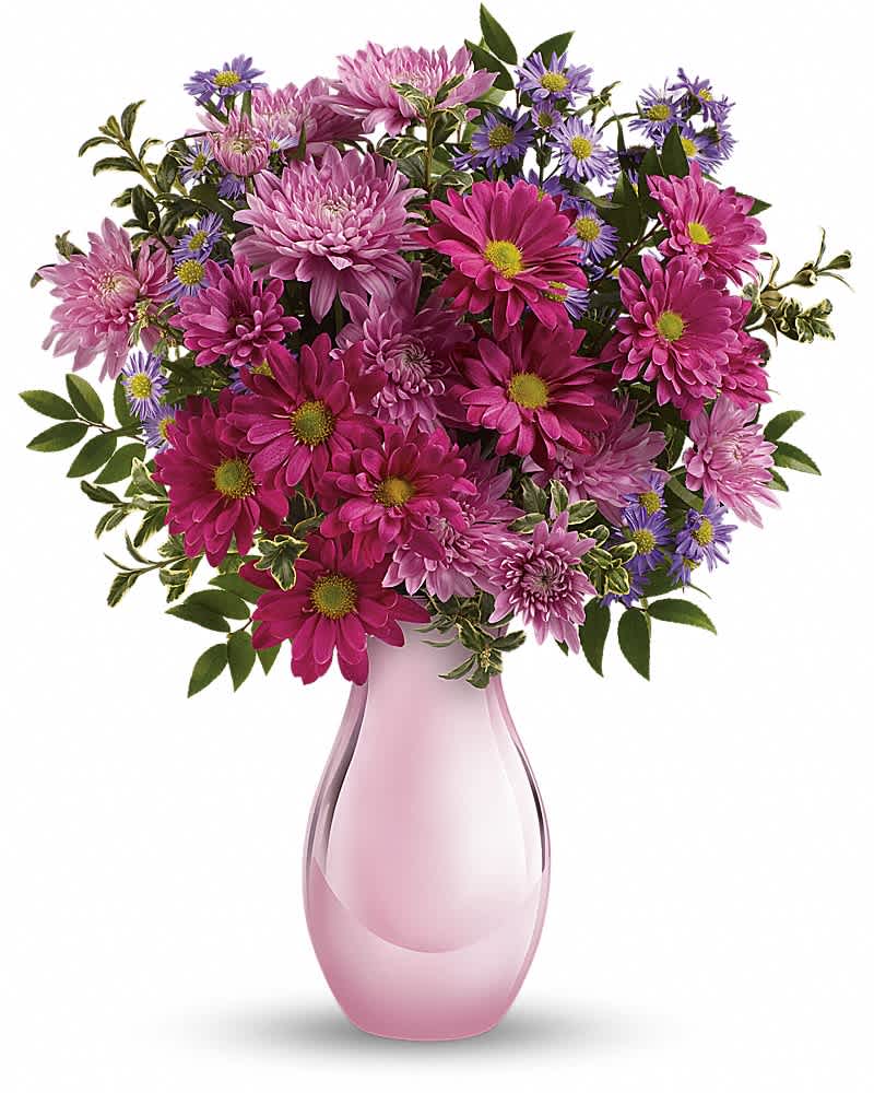 Teleflora's Time Together Bouquet Teleflora's Time Together Bouquet - Simply sweet, this charming bouquet of asters and chrysanthemums is accented with a shimmering pink keepsake vase she'll always treasure. Purple monte cassino asters, lavender cushion chrysanthemums and pink daisy chrysanthemums are arranged with huckleberry and oregonia. Delivered in a beautiful Pink Reflections vase.