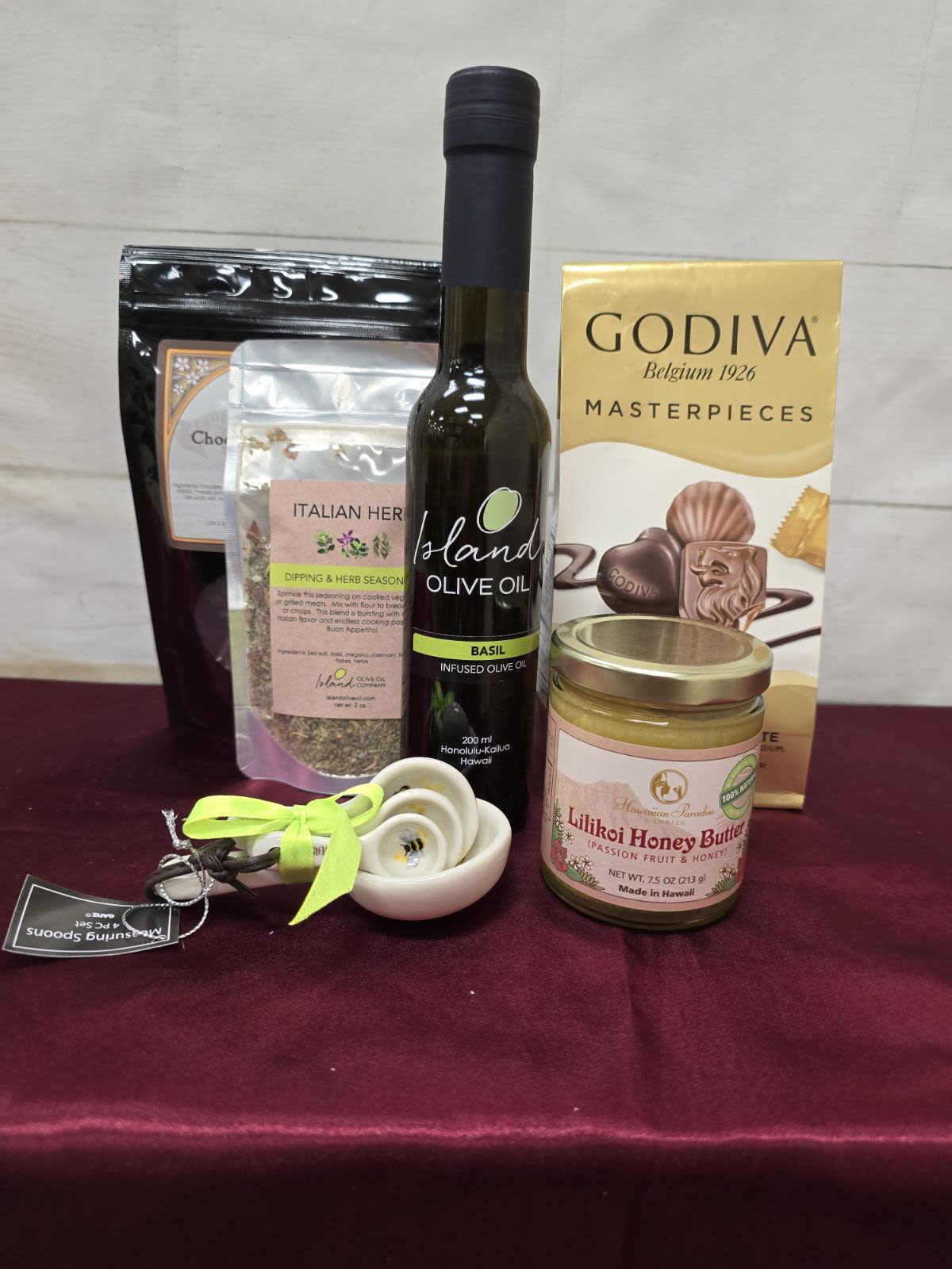 New Item: Petite Gourmet basket (individual retail value $75) - – This fun and Petite Gourmet basket the the following featured items   Petite Gourmet basket (FGOUBAS - $75) 1 - IOO Flavored Oil or Vinegar  1 - IOO Dipping Blend 1 - HPC Fruit Butter 7.5oz 1 - Measuring Spoon 1 - HPC Chocolate Almond or Pretzel Cluster 1 - Godiva Assorted Gems 