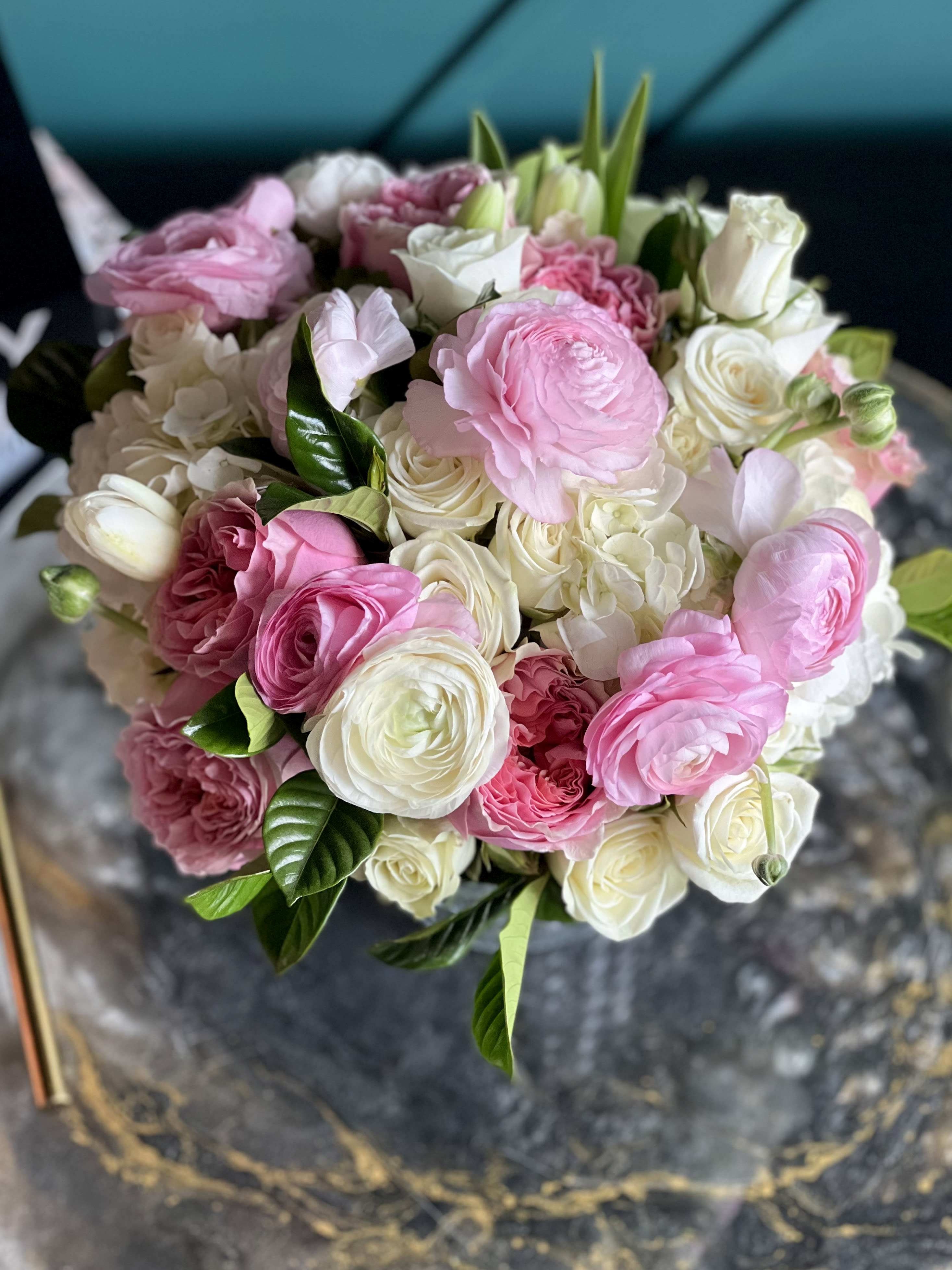 Delicate mix - Vase flower design with white roses, ranunculus, spray roses, tulips, garden roses  and mixed seasonal flowers. 